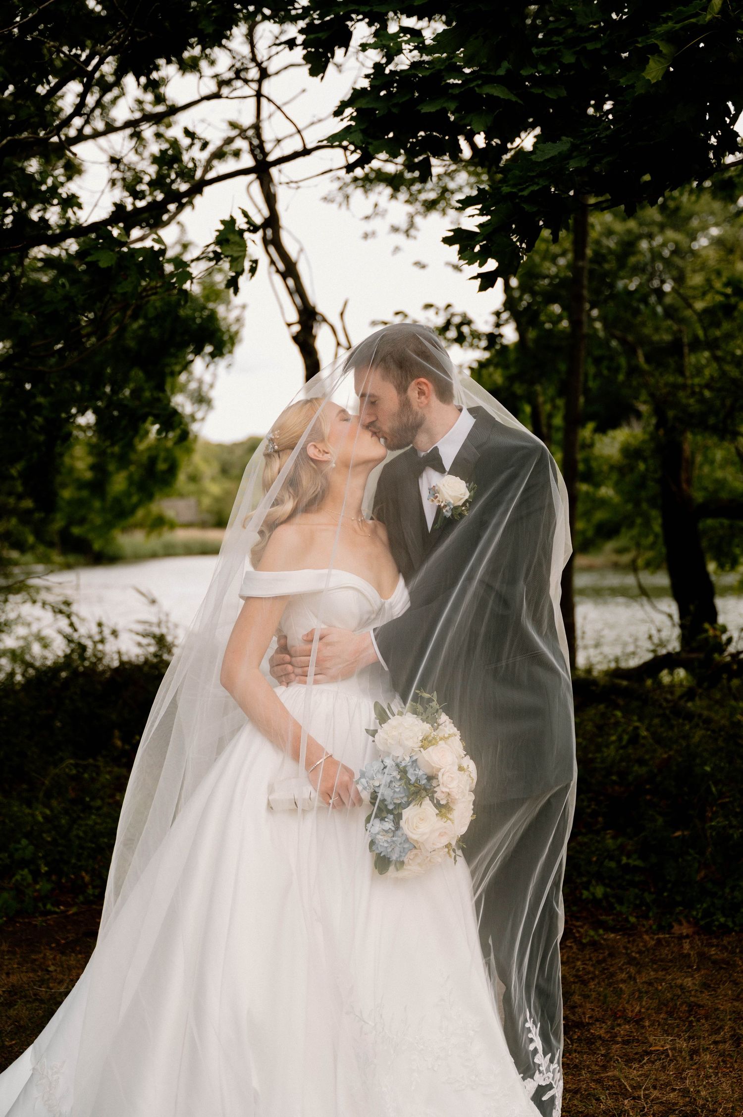 Photo of bride and groom under a veil taken at Three Village Inn, Stony Brook, Long Island, NY
