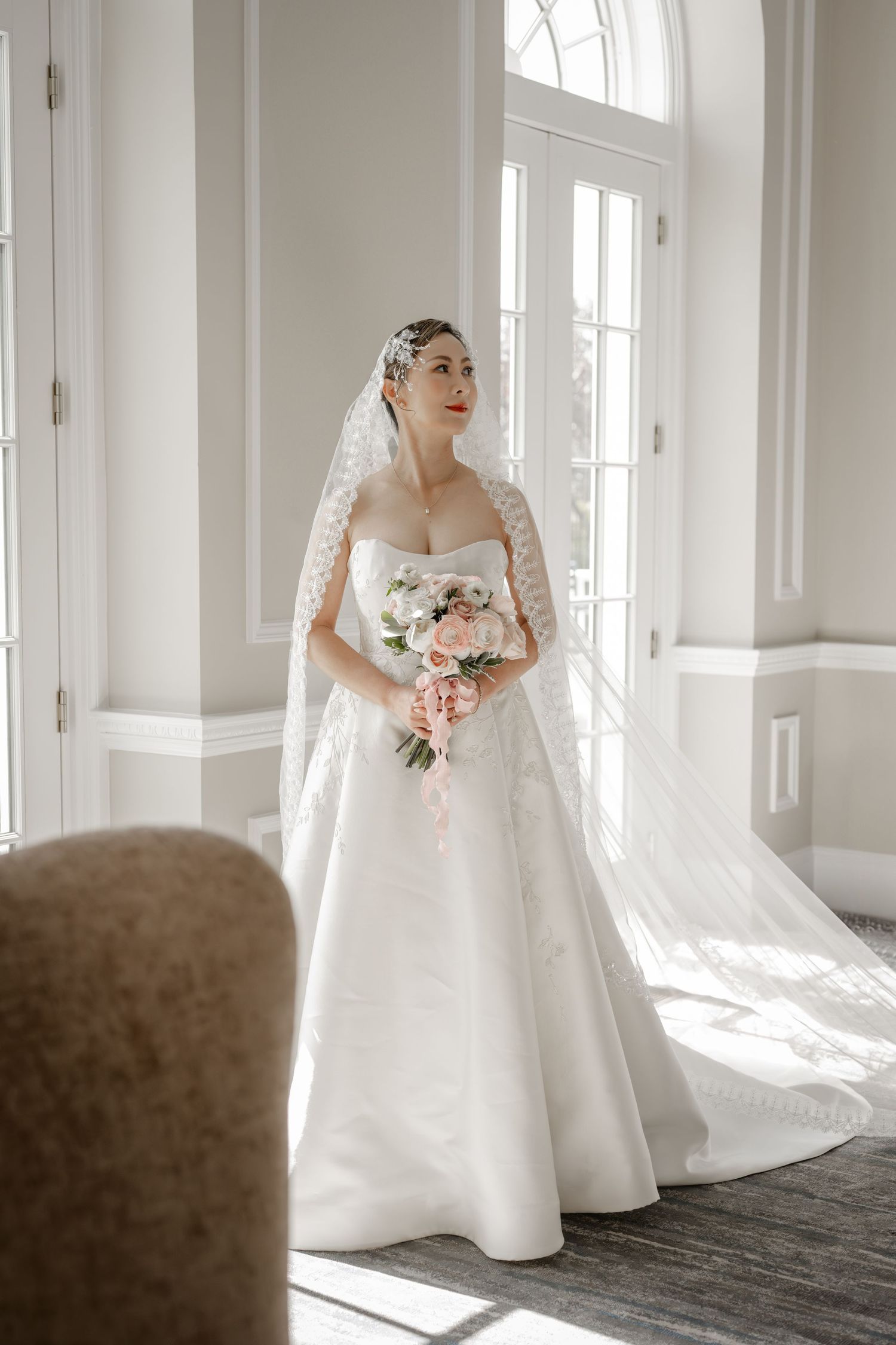 Bride with muted floral bouquet on Long Island