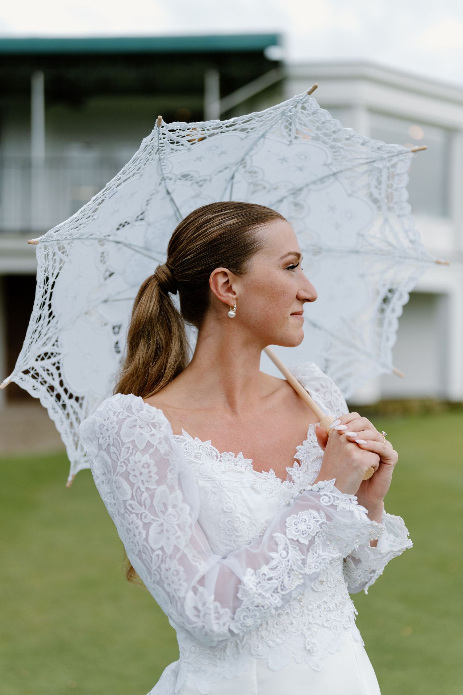 Editorial Style Wedding Photo of Bride With Lace Umbrella at Inwood Country Club, Long Island