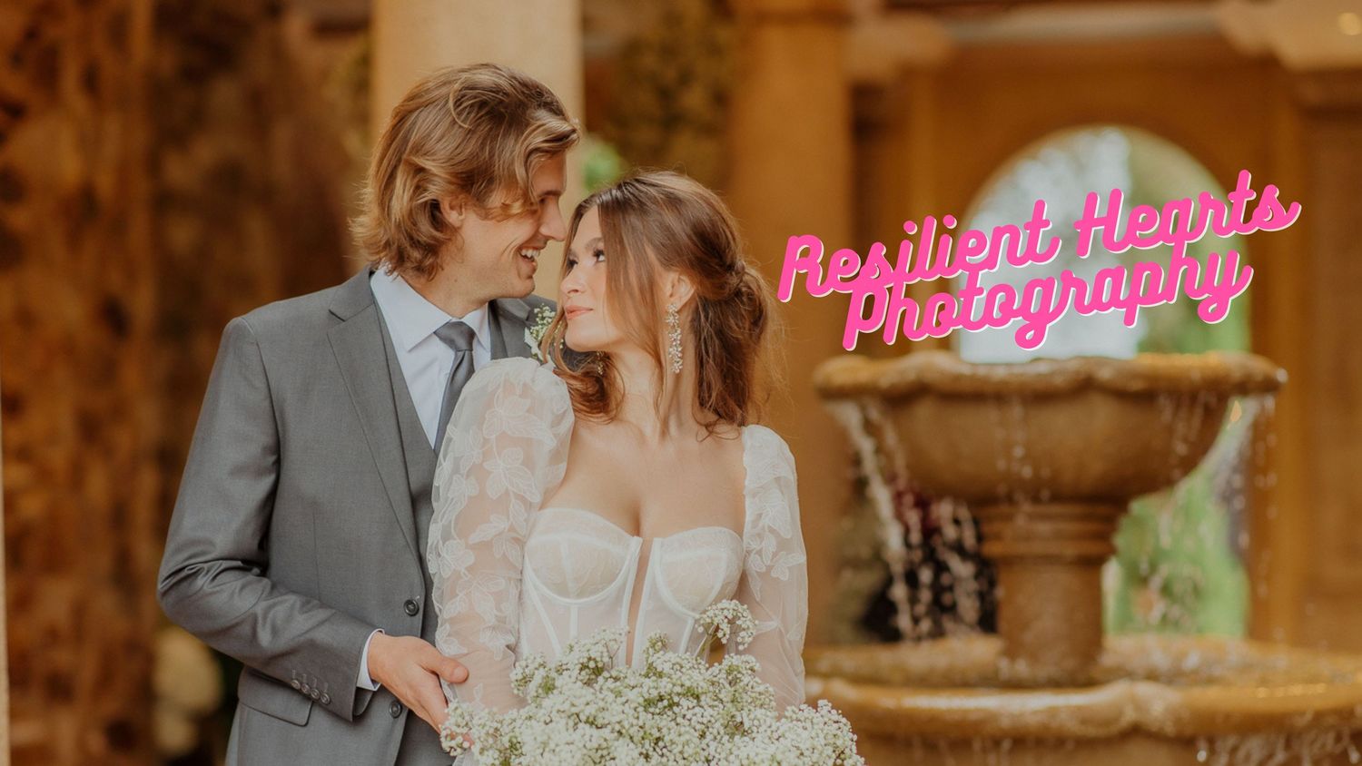 Romantic couple shares an intimate moment in a grand stone hallway with warm golden lighting.