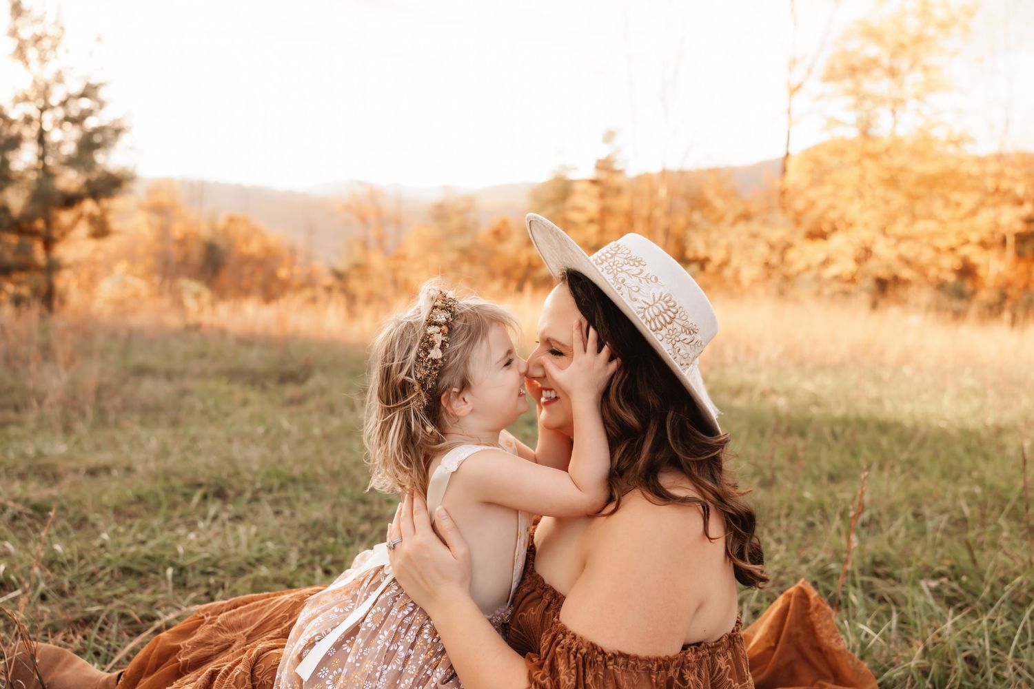 Parents and children laughing together during fall family photos in Hickory NC