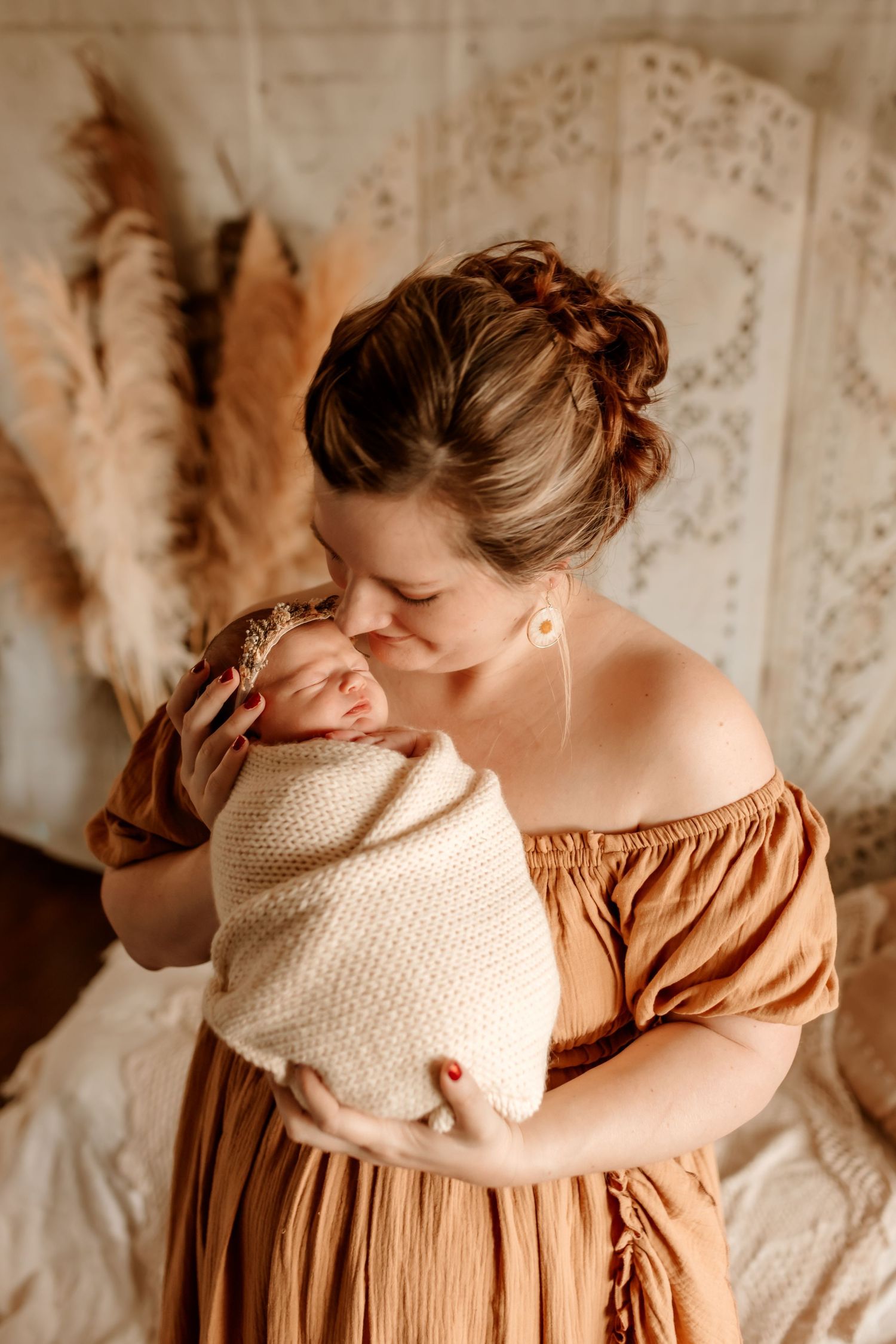 Parents holding newborn during in-home session in Sherrills Ford NC