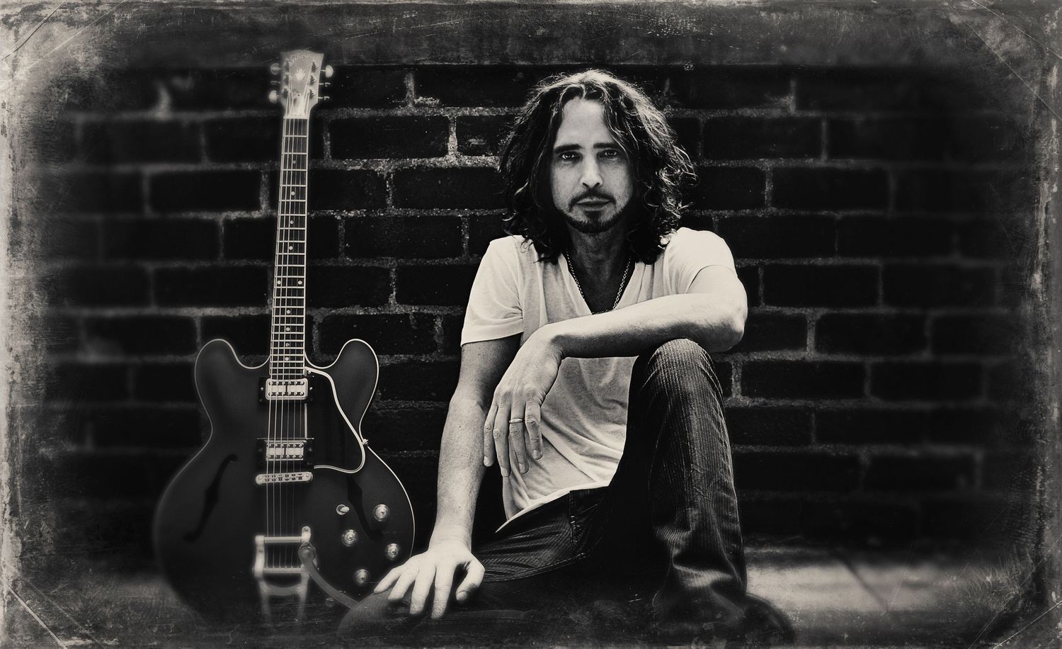 Chris Cornell Branding black and white portrait sitting against brick wall green Signature ES 335 Gibson Guitar leaning against wall