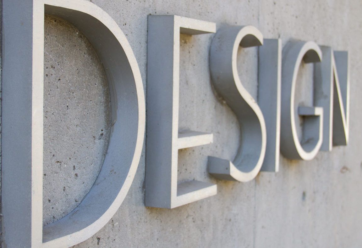 Corporate Lifestyle photography three quarter angle of sign on campus building ENV Magazine page 6