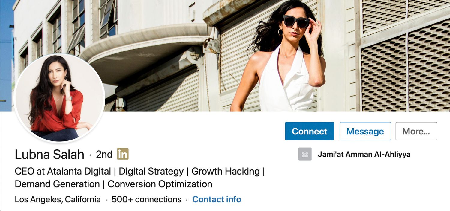 LinkedIn Profile Headshot with Banner Image of Lubna Salah circle insert red dress shirt arms and legs crossed one hand to her cheek