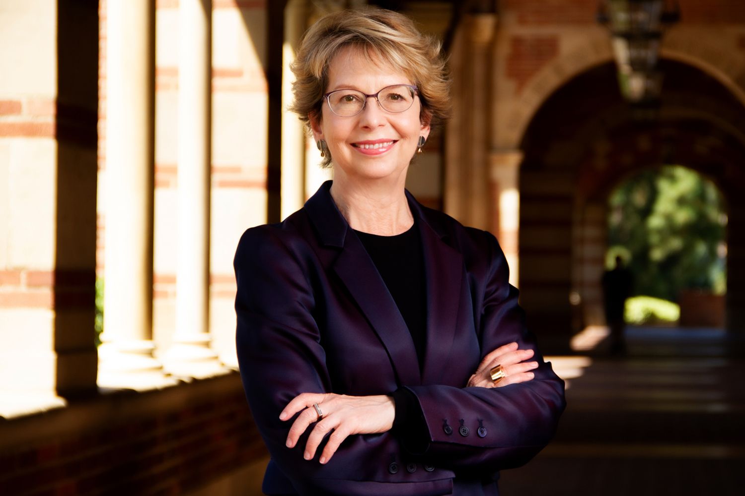 Business Headshot Robin Garrell UCLA Los Angeles arms crossed standing in hallway