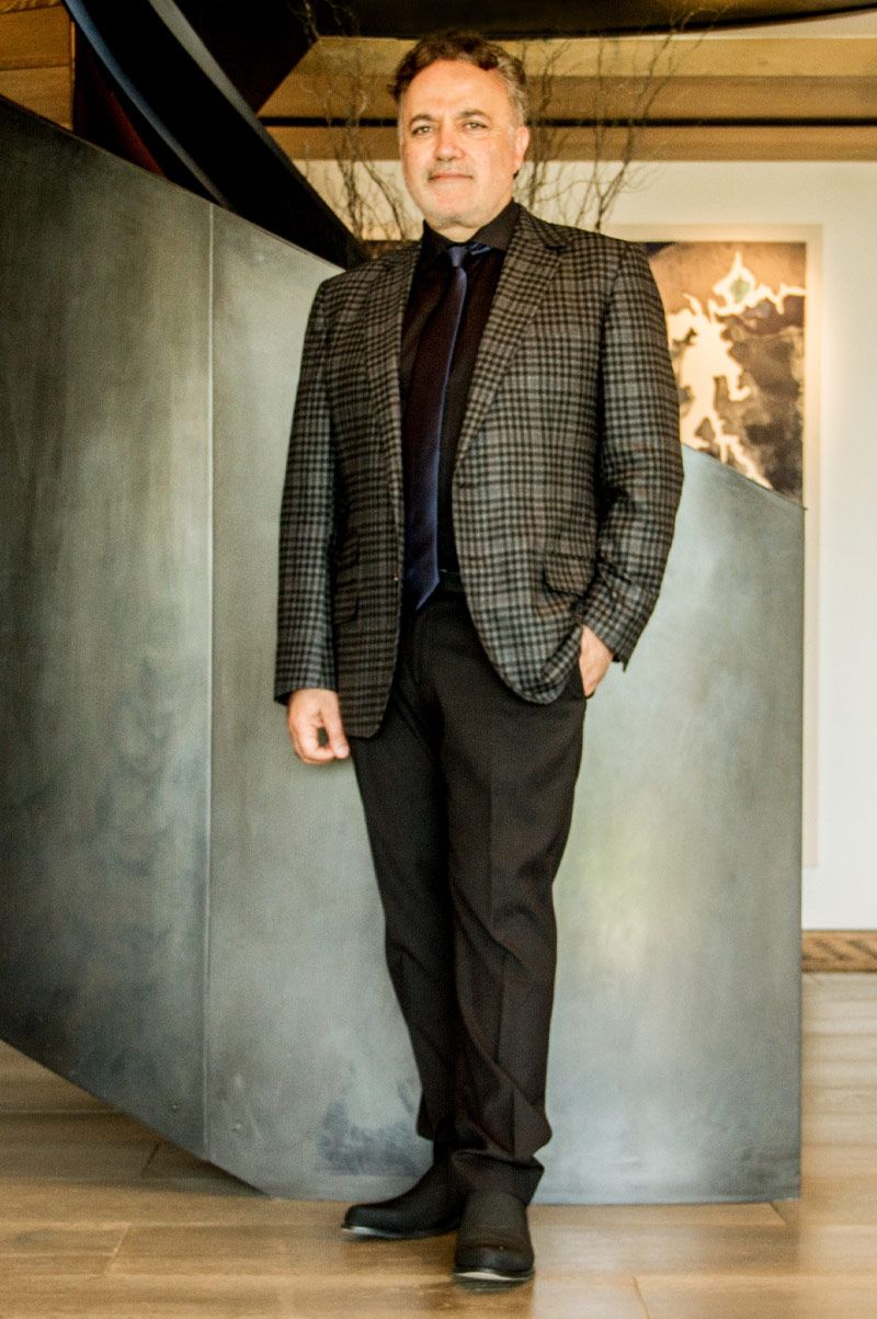 Fine Art Executive Portrait Ardie Tavangarian  Los Angeles standing in front of spiral staircase