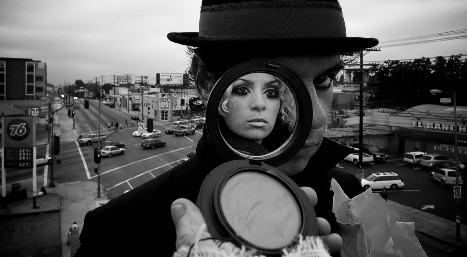 Musical duo portrait MBAGC black and white close up circle compact mirror reflect half covering members face
