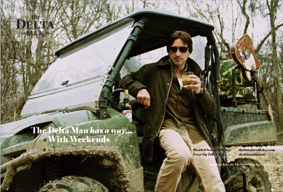 Branding Photography Steve Azar Fat Trout Whiskey The Delta Man sitting on all terrain vehicle holding whisky glass