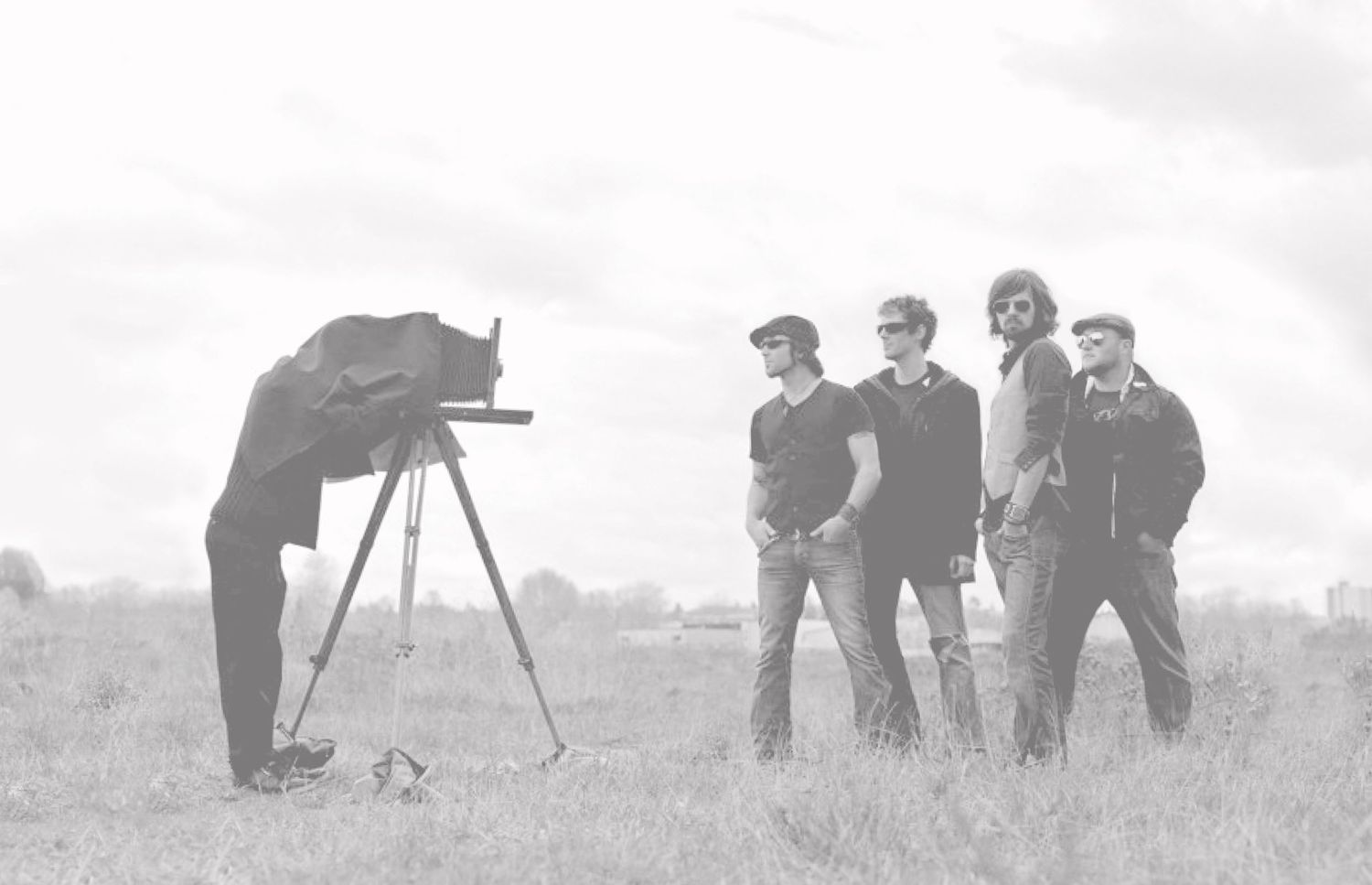 Photography Business Basics Book Cover Image Photographer standing behind bellowed camera on tripod with cloth over his head photographing