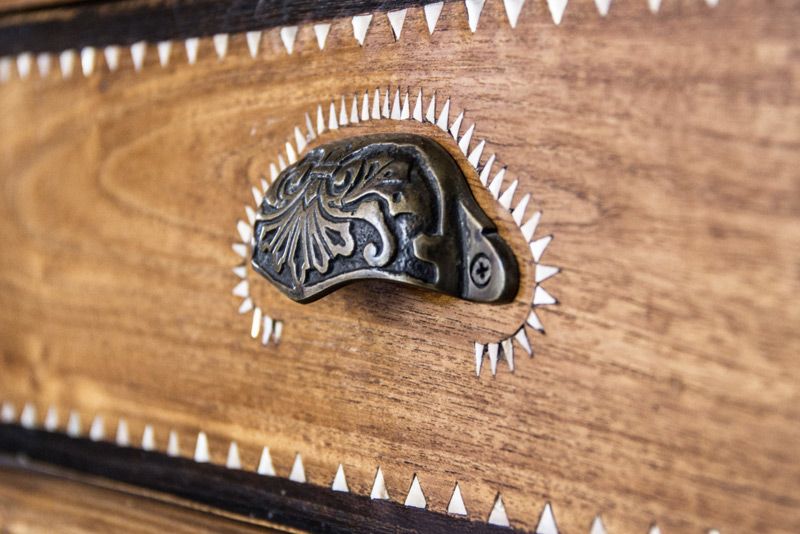 Location Branding close up dresser handle embossed metal