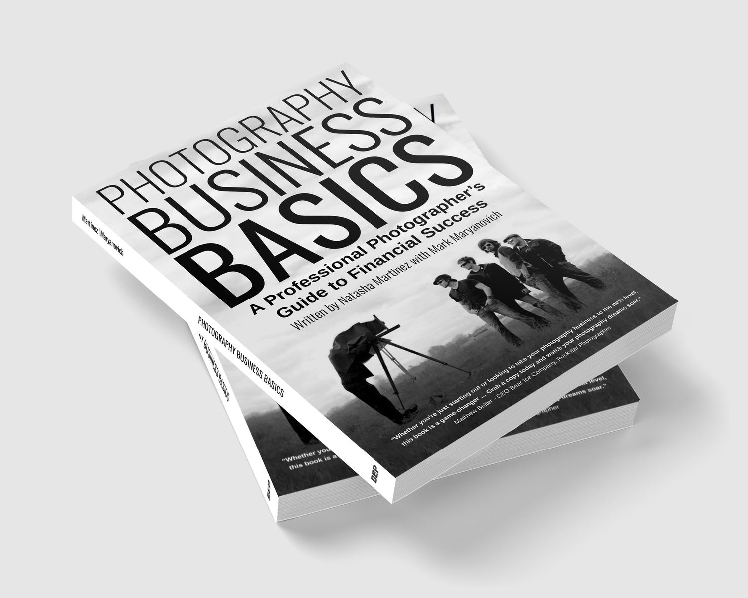 Photography business book cover with silhouette of photographer using tripod on black and white design.