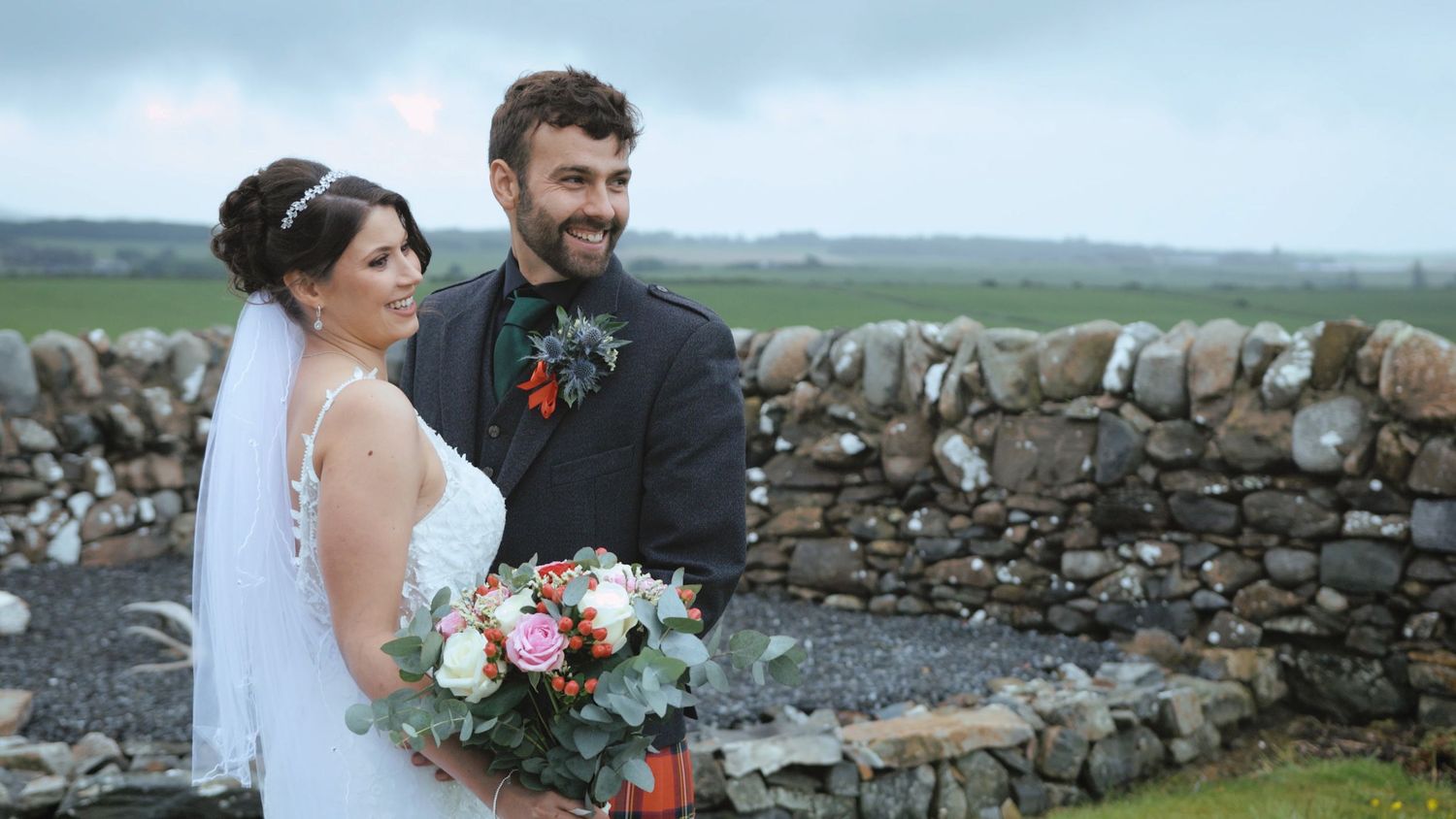 Bride and groom holding each other at Port William, Dumfries and Galloway
