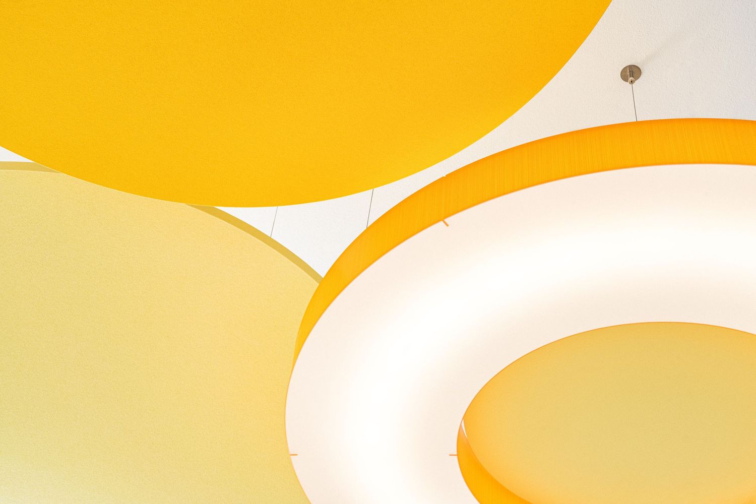 Abstract background with curved yellow and white shapes forming a minimalist design pattern.