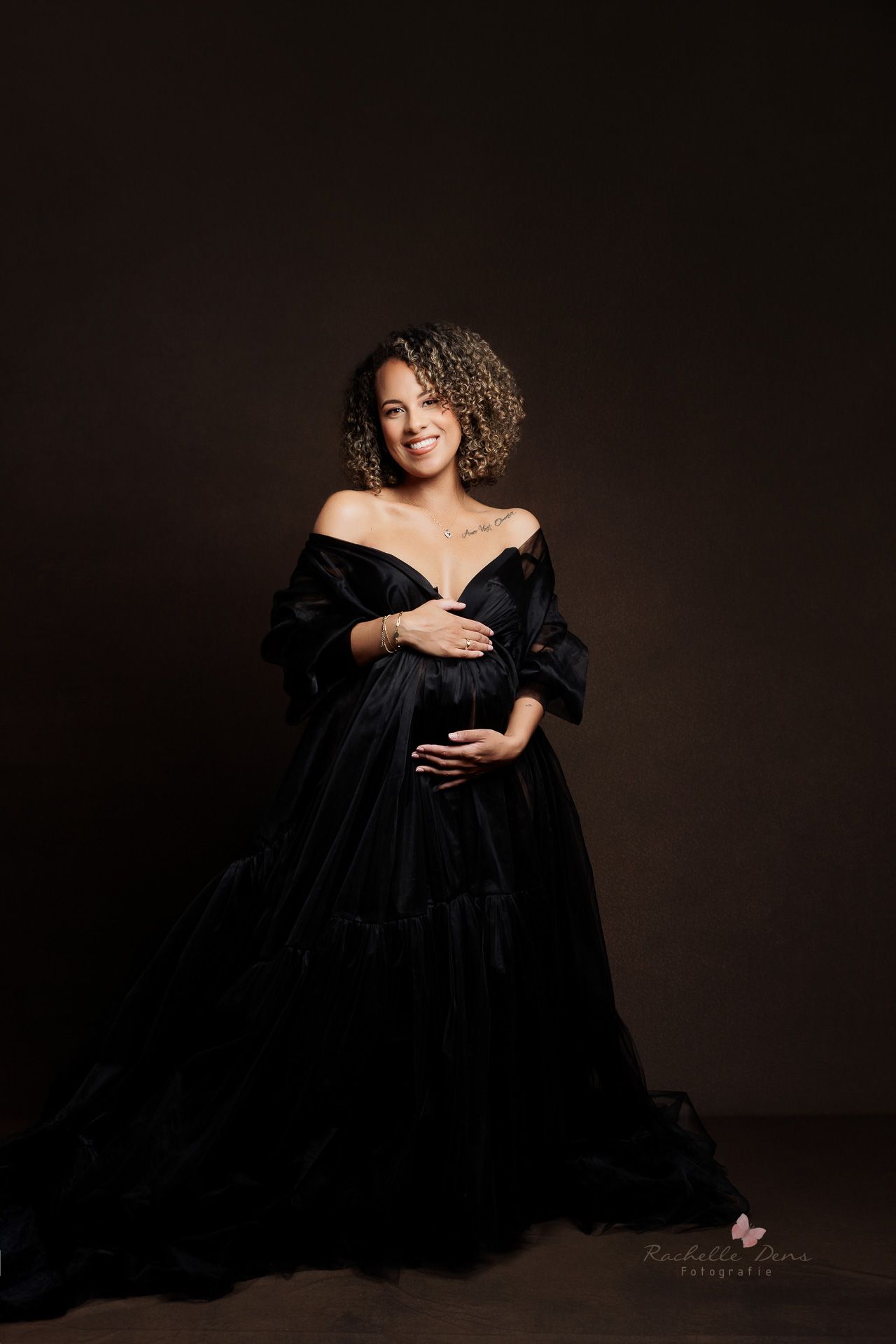 A figure in a flowing black dress poses elegantly against a dark background in a series of artistic portraits.