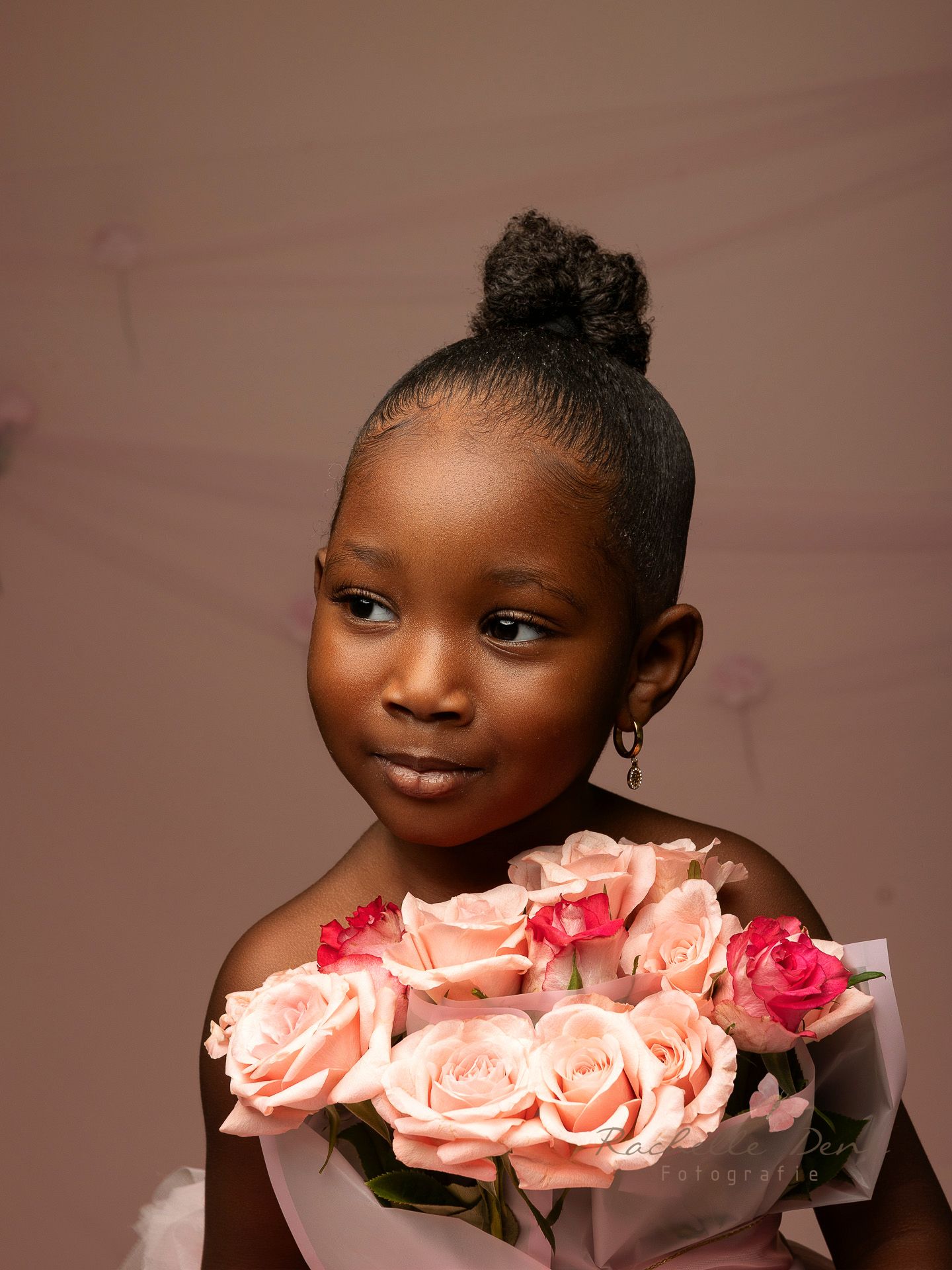 A series of five artistic portraits showing a figure with pink roses against a brown studio backdrop.