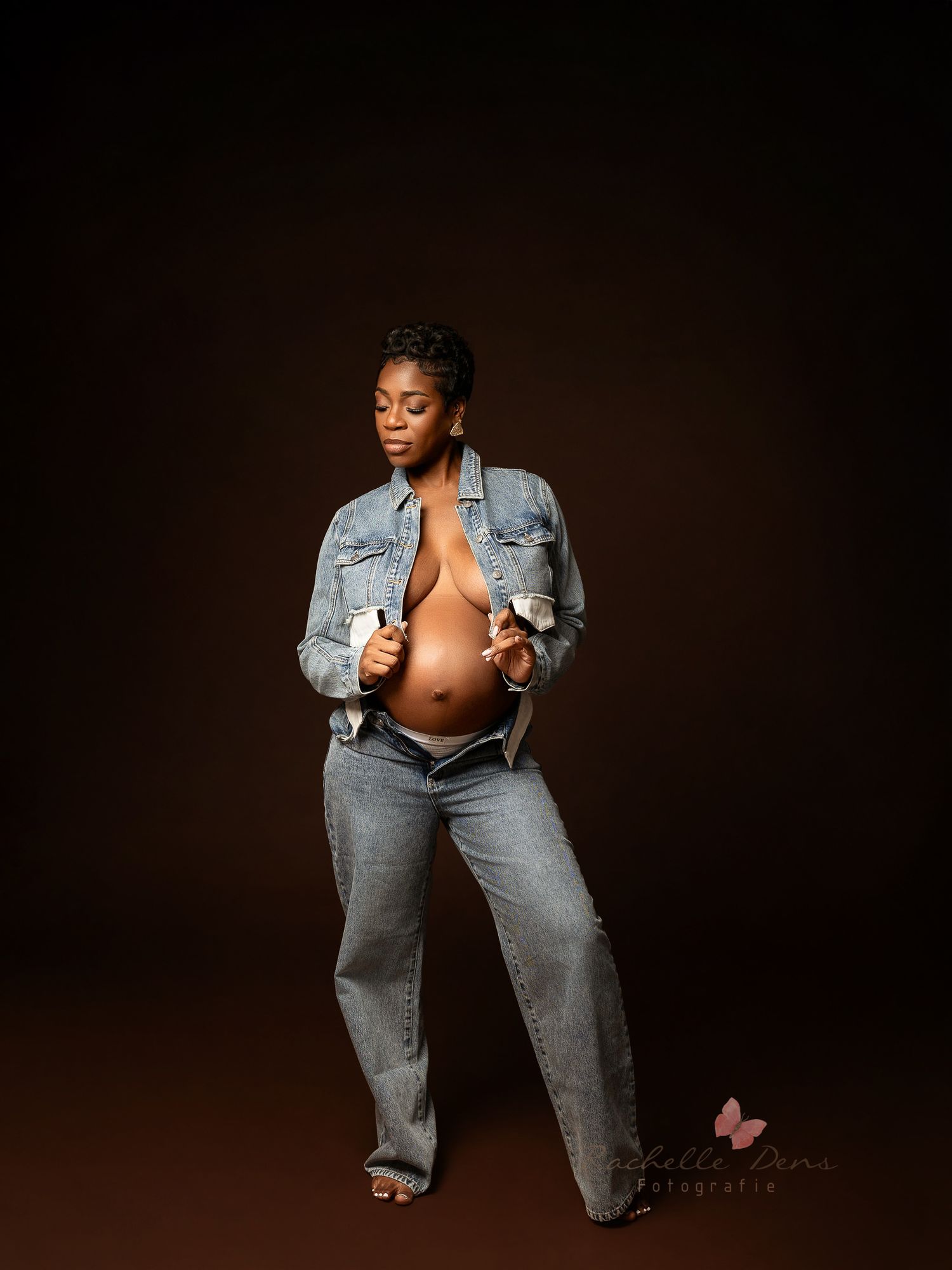 A creative maternity photo series showing a pregnant woman in denim against a dark background with artistic poses.