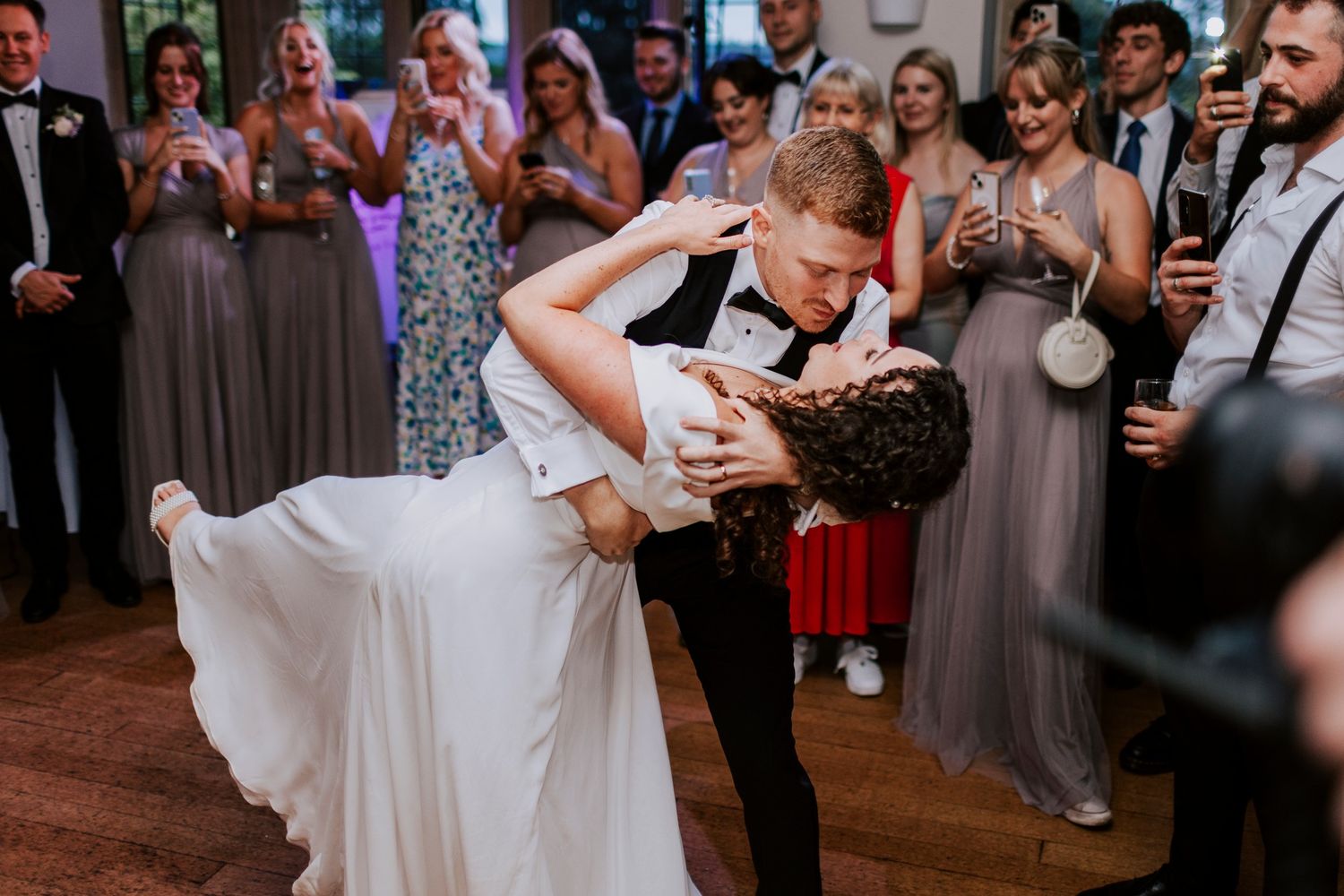 Wedding reception dance floor filled with guests enjoying the celebration.