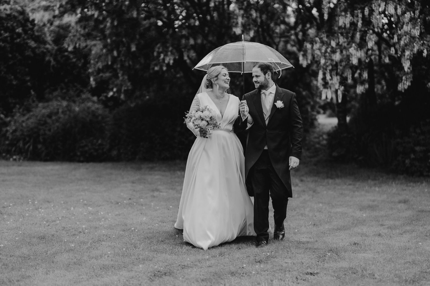 Black and white wedding photos capturing romantic outdoor moments with soft natural light.