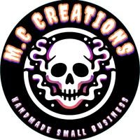 Black and white circular logo featuring a skull with lightning bolts and text reading 'DC Creators' in a retro style.
