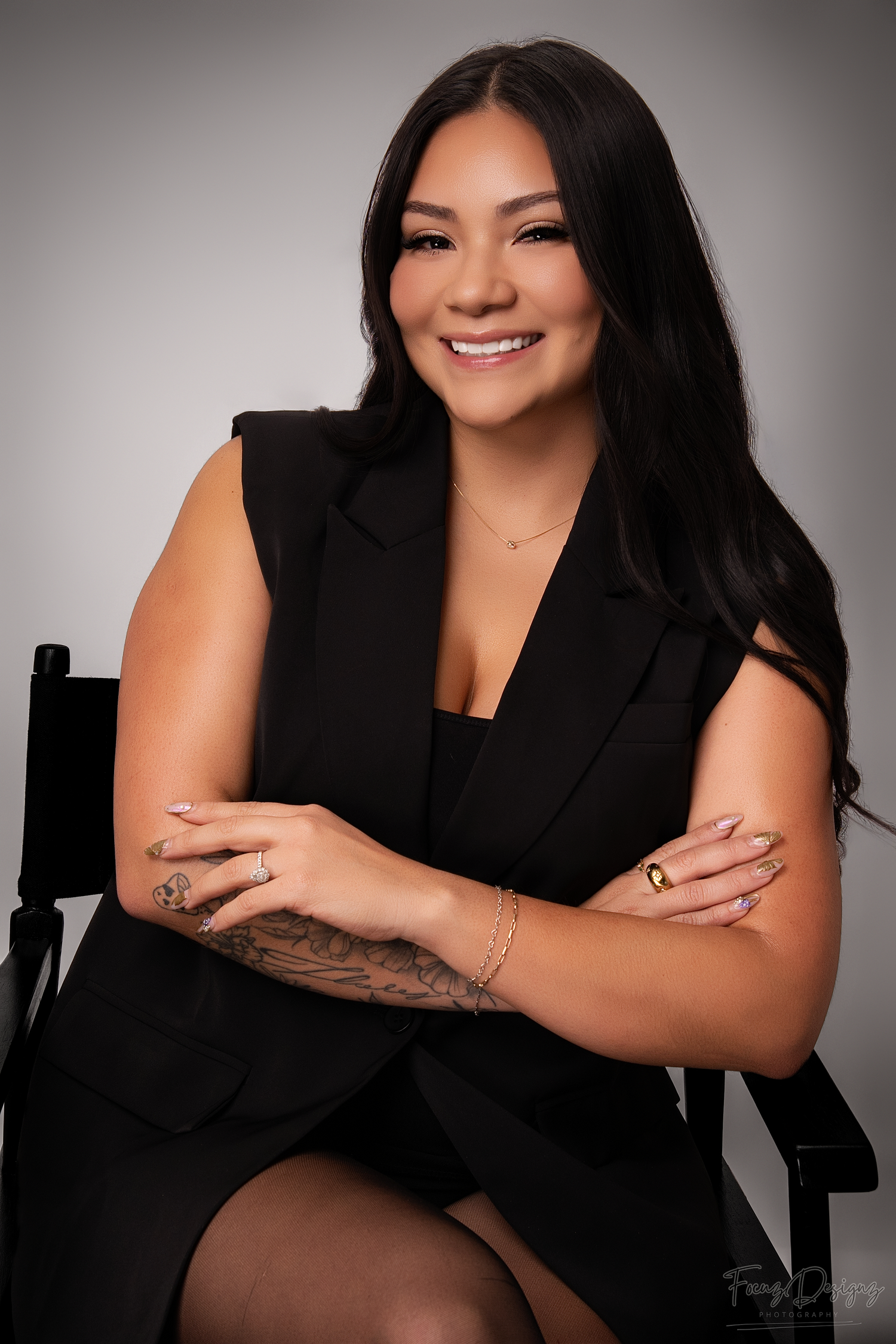 Professional headshot series in black attire against grey background showing warm expressions and natural poses.