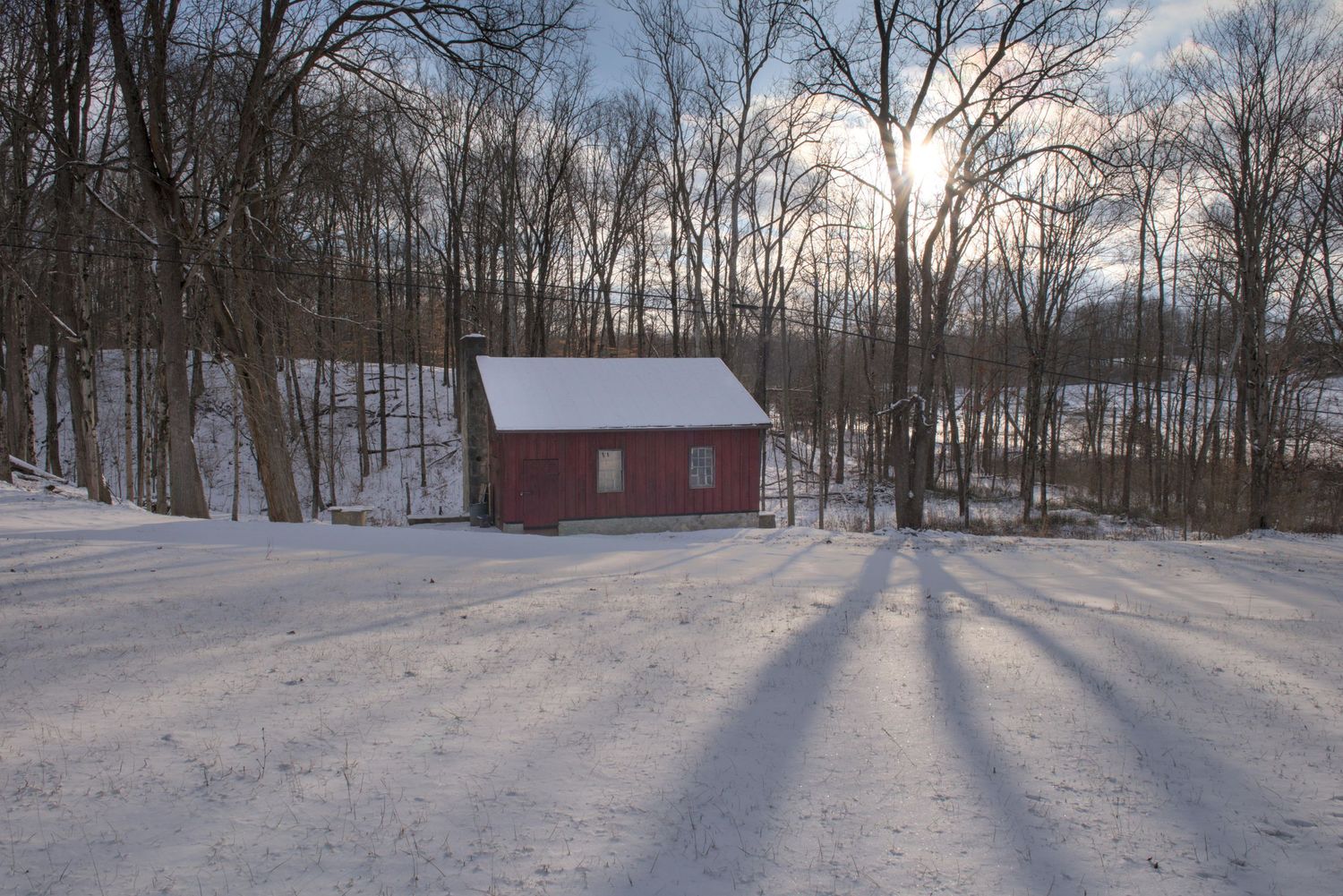A small red shack sits in a snow covered holler on 725 east of Gratis.