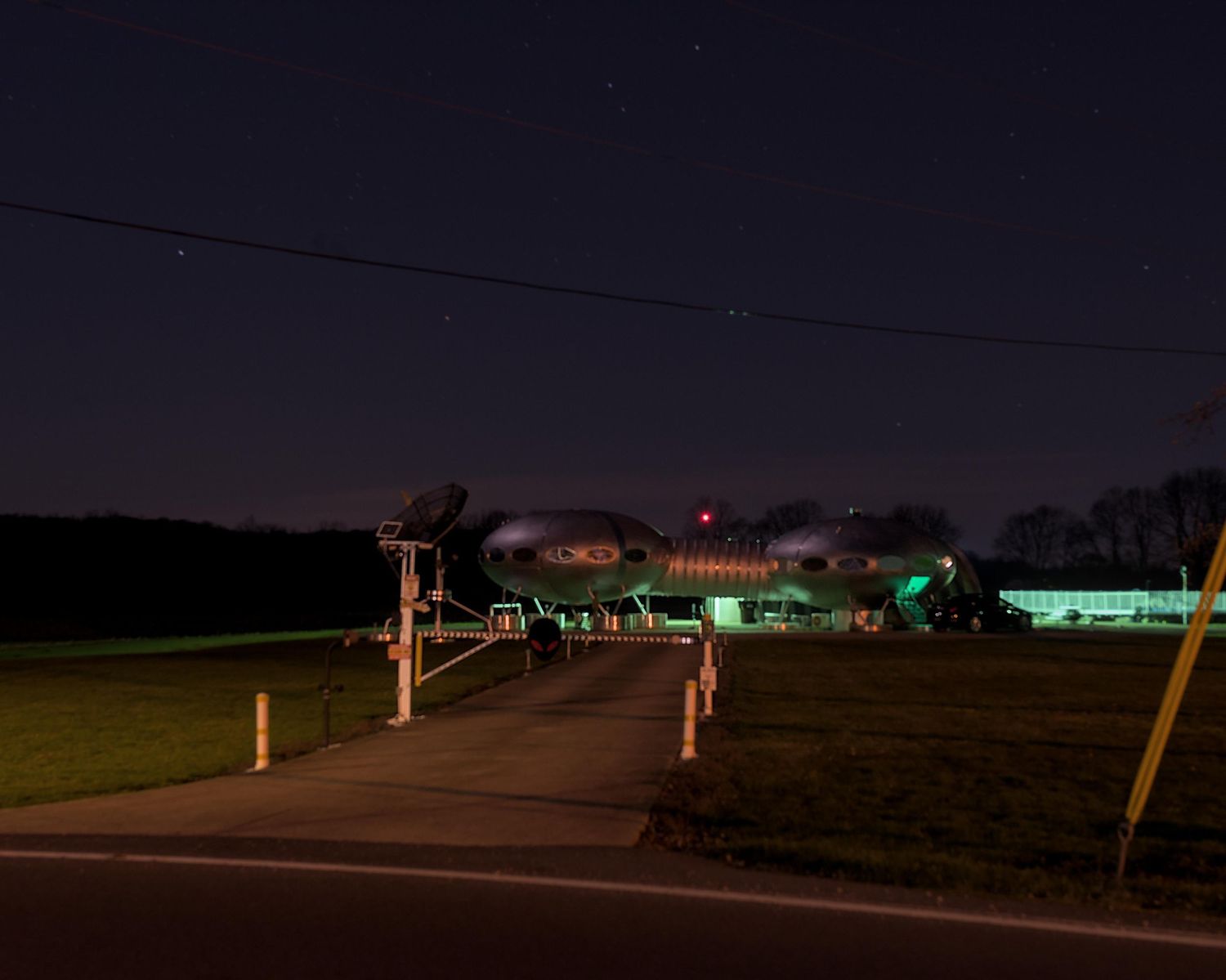 A night time image of a UFO house in Carlisle, Ohio.
