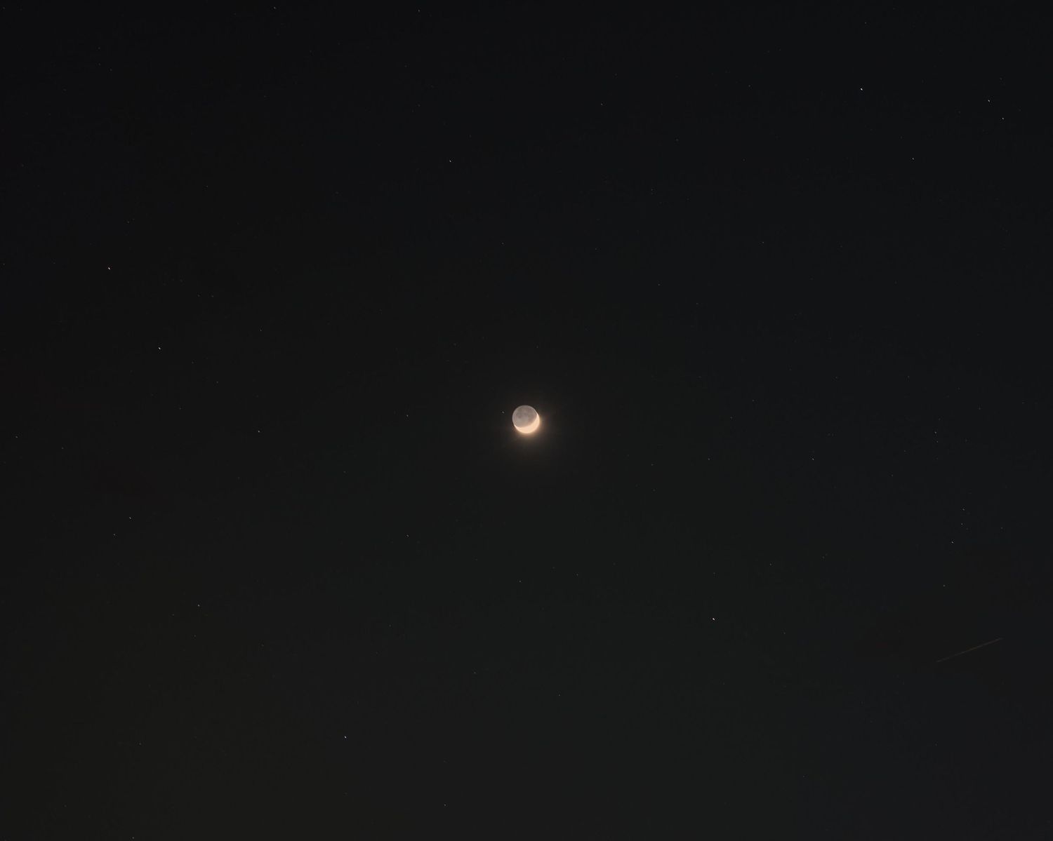 Is it a waning or waxing crescent moon? I do not know. There is a small sliver of light of the moon reflecting the sun.
