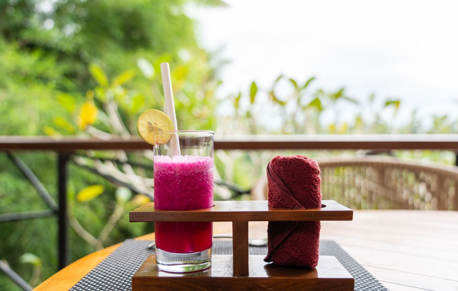 Welcome drink served in a resort setting with tropical details.