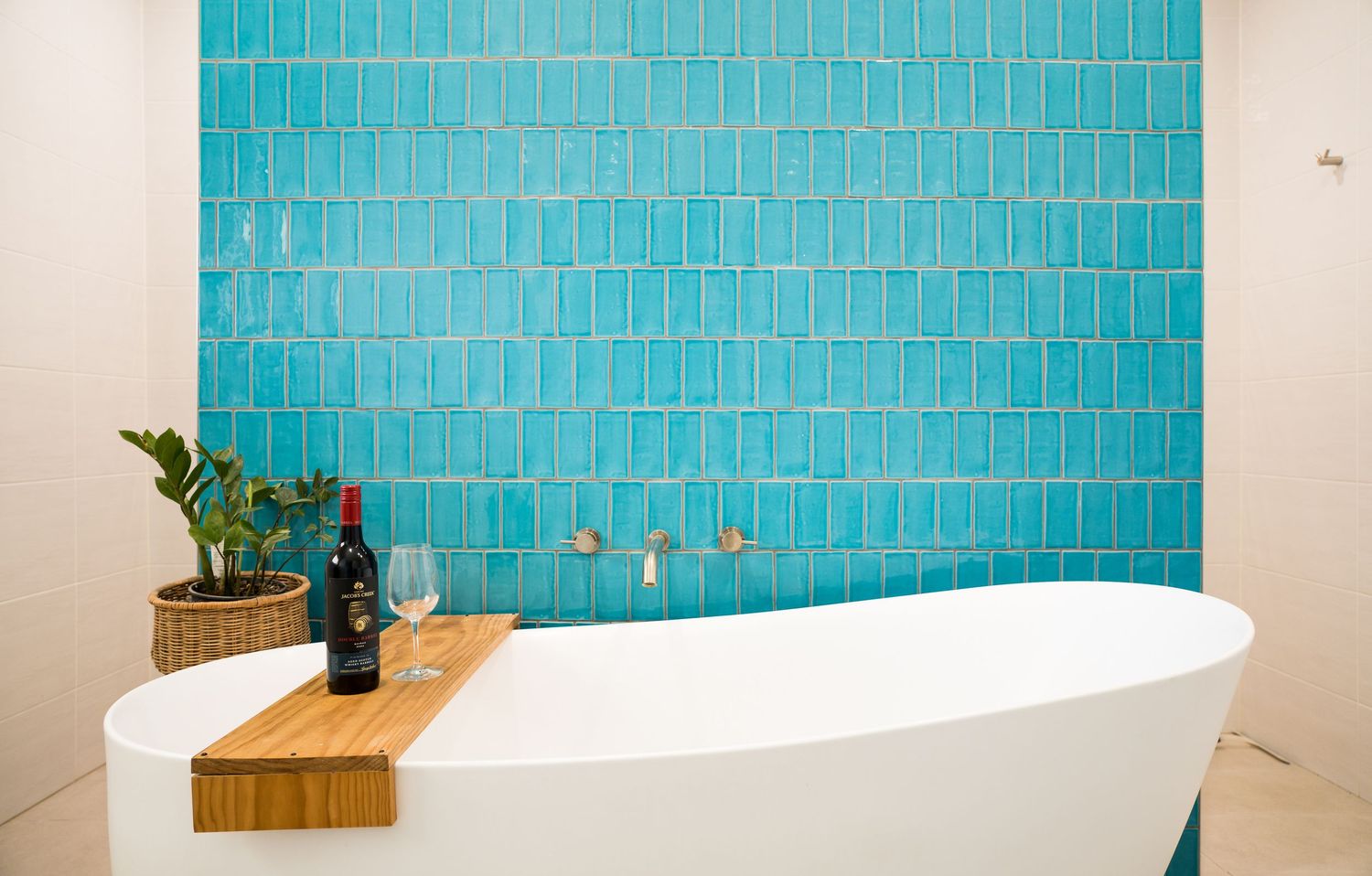 Bright modern bathroom with clean tiles and natural light.