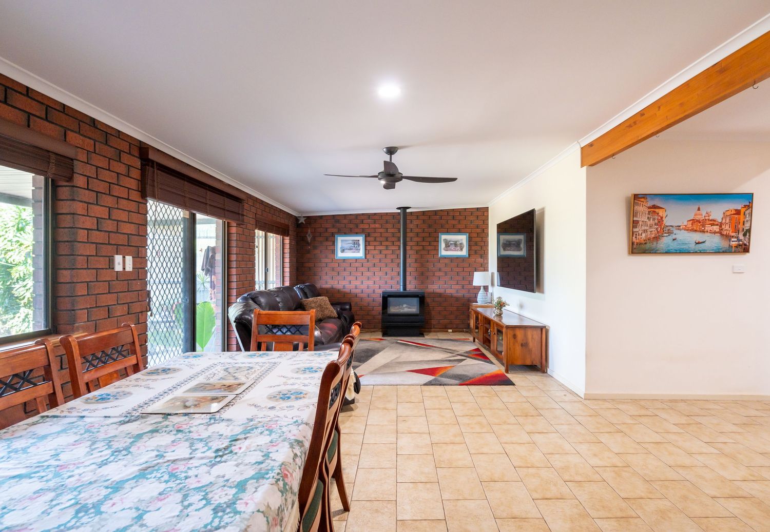 Open‑plan lounge and dining area with modern furnishings.