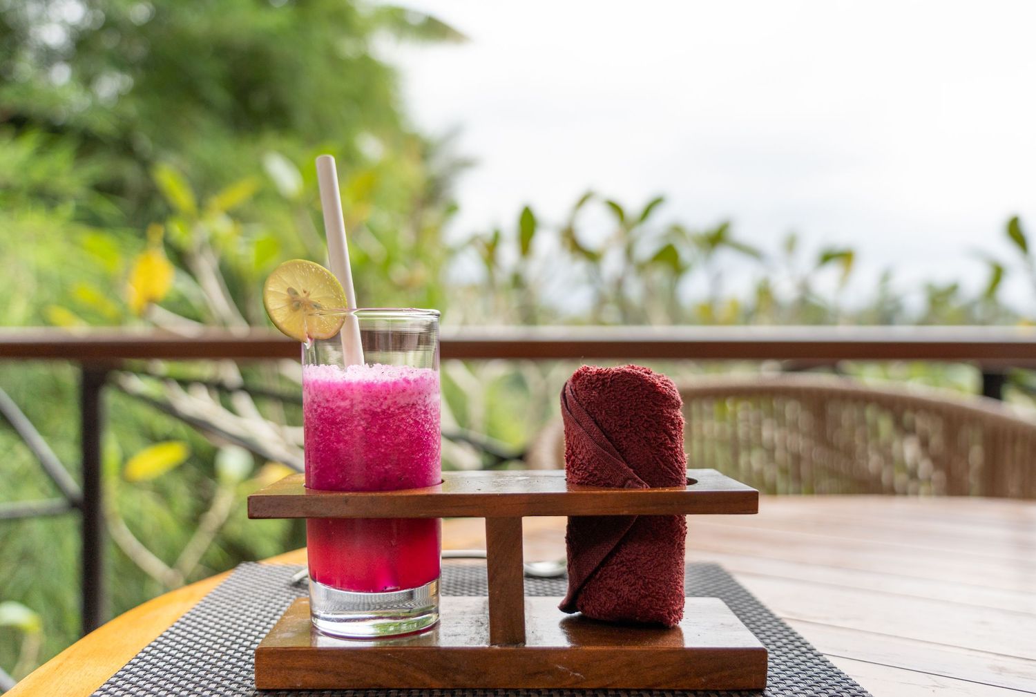 Welcome drink served in a resort setting with tropical details.