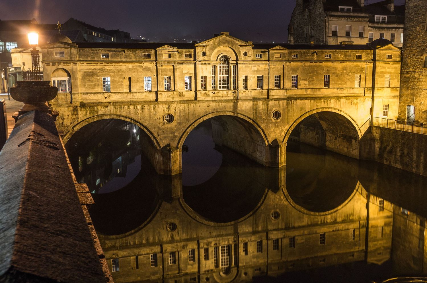 Pulteney Bridge in Bath with historic stone architecture over the river.
