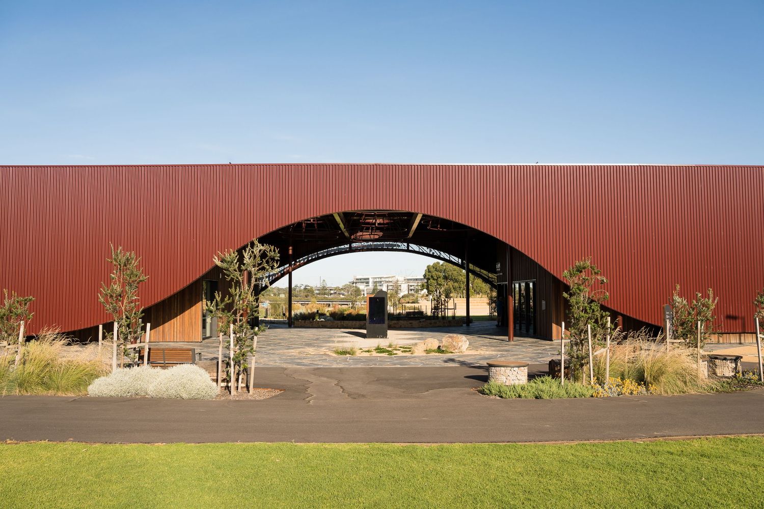 Modern Indigenous-inspired architecture in Port Adelaide with red iron façade.