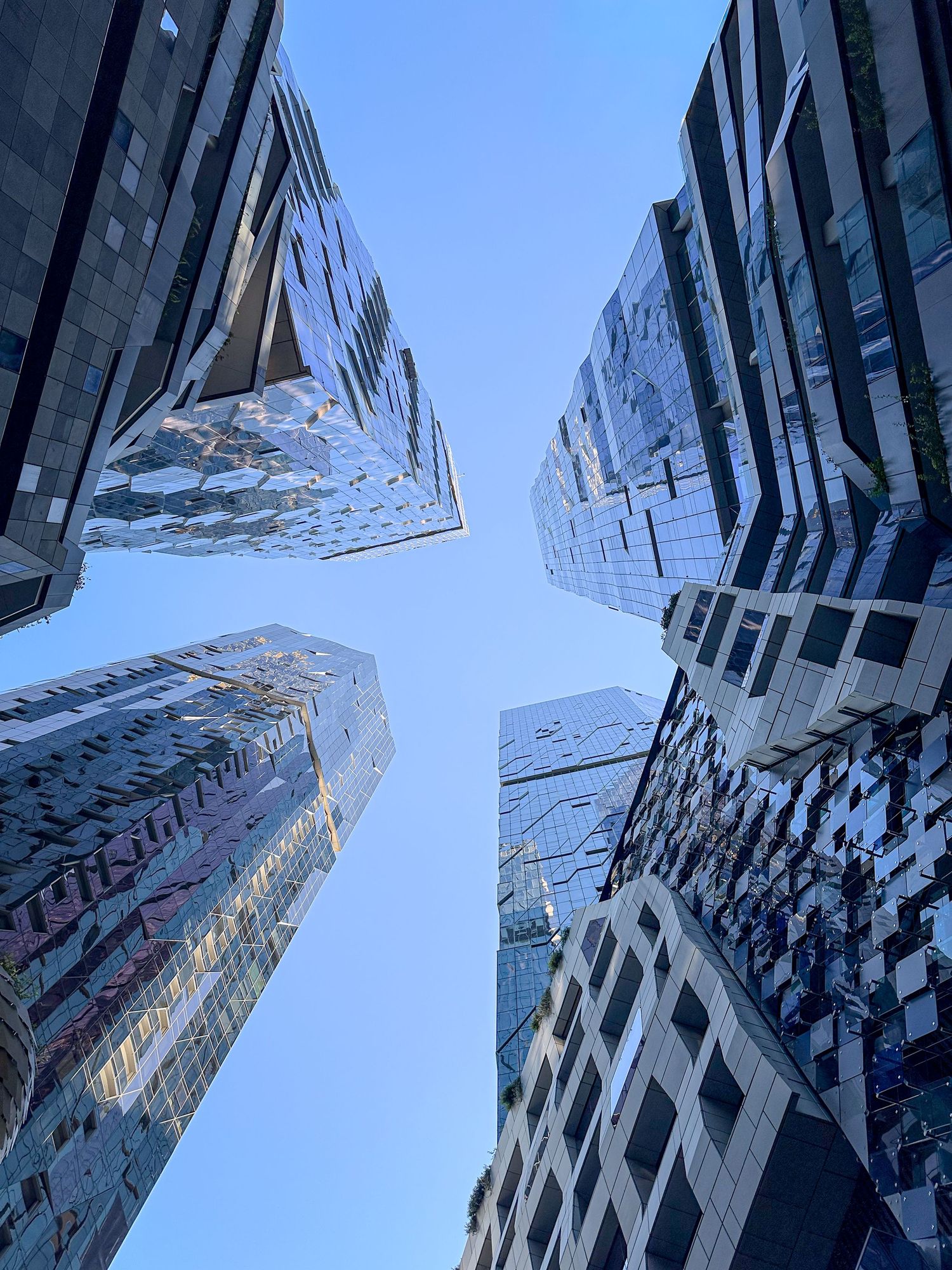 City skyline photographed from below with strong architectural lines.