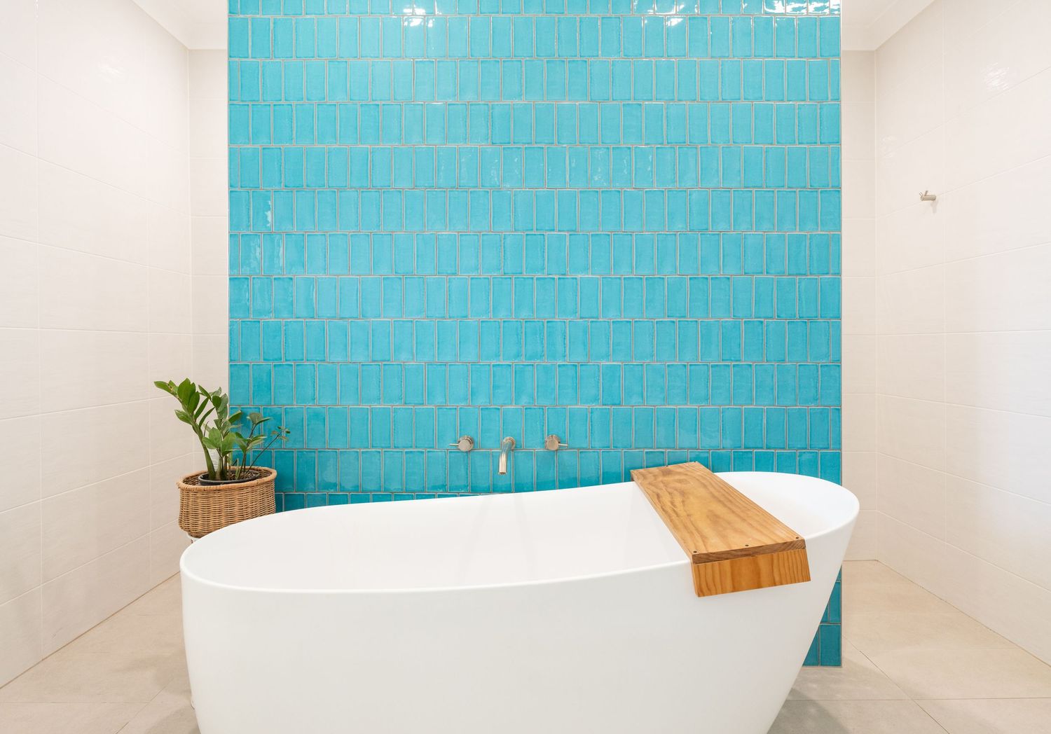 Bright modern bathroom with clean tiles and natural light.
