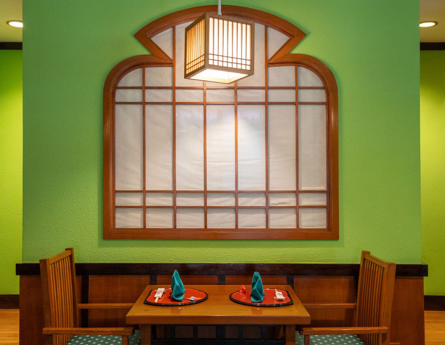 Japanese restaurant interior with warm lighting and traditional décor.