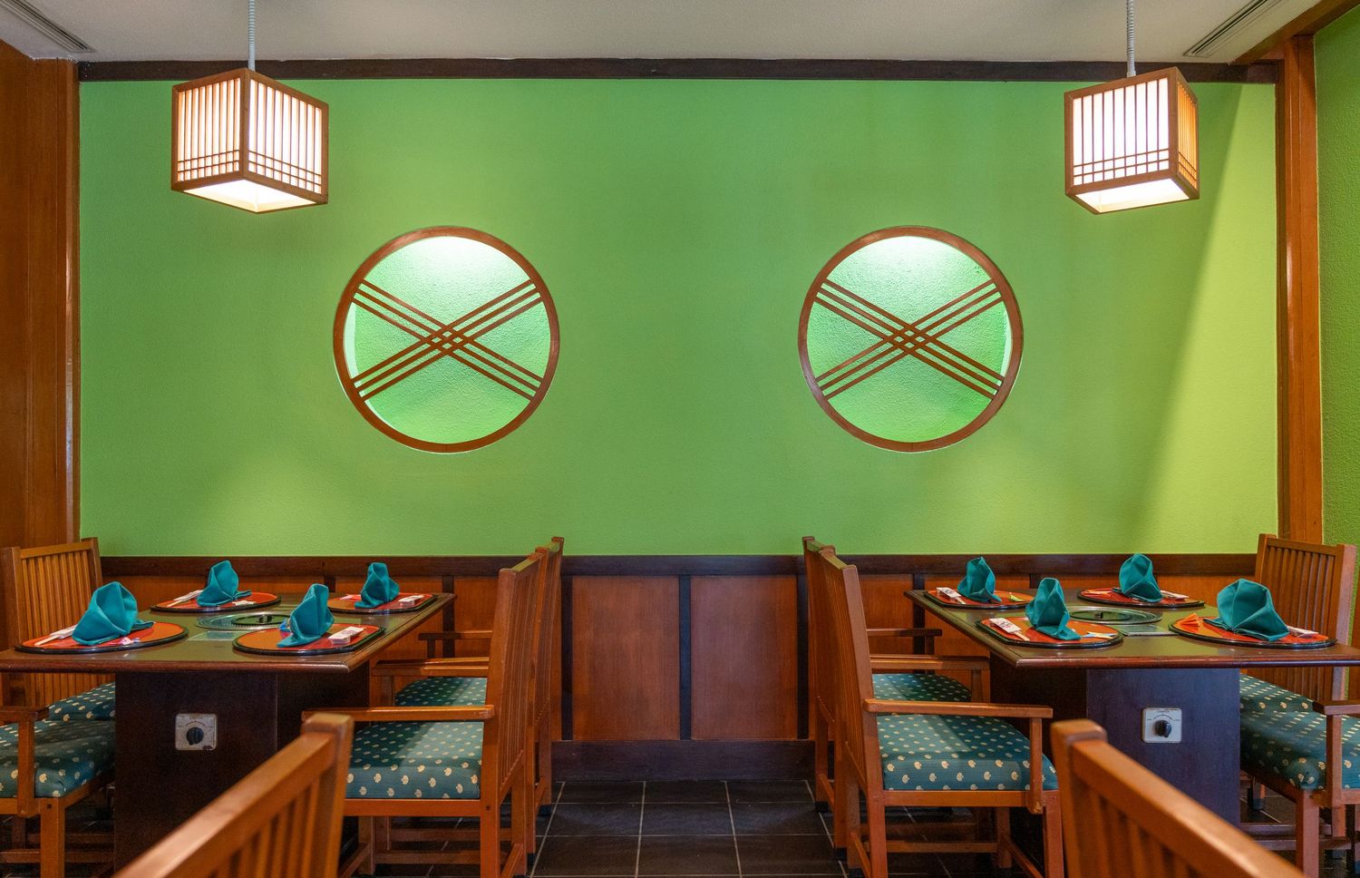 Japanese restaurant interior with warm lighting and traditional décor.