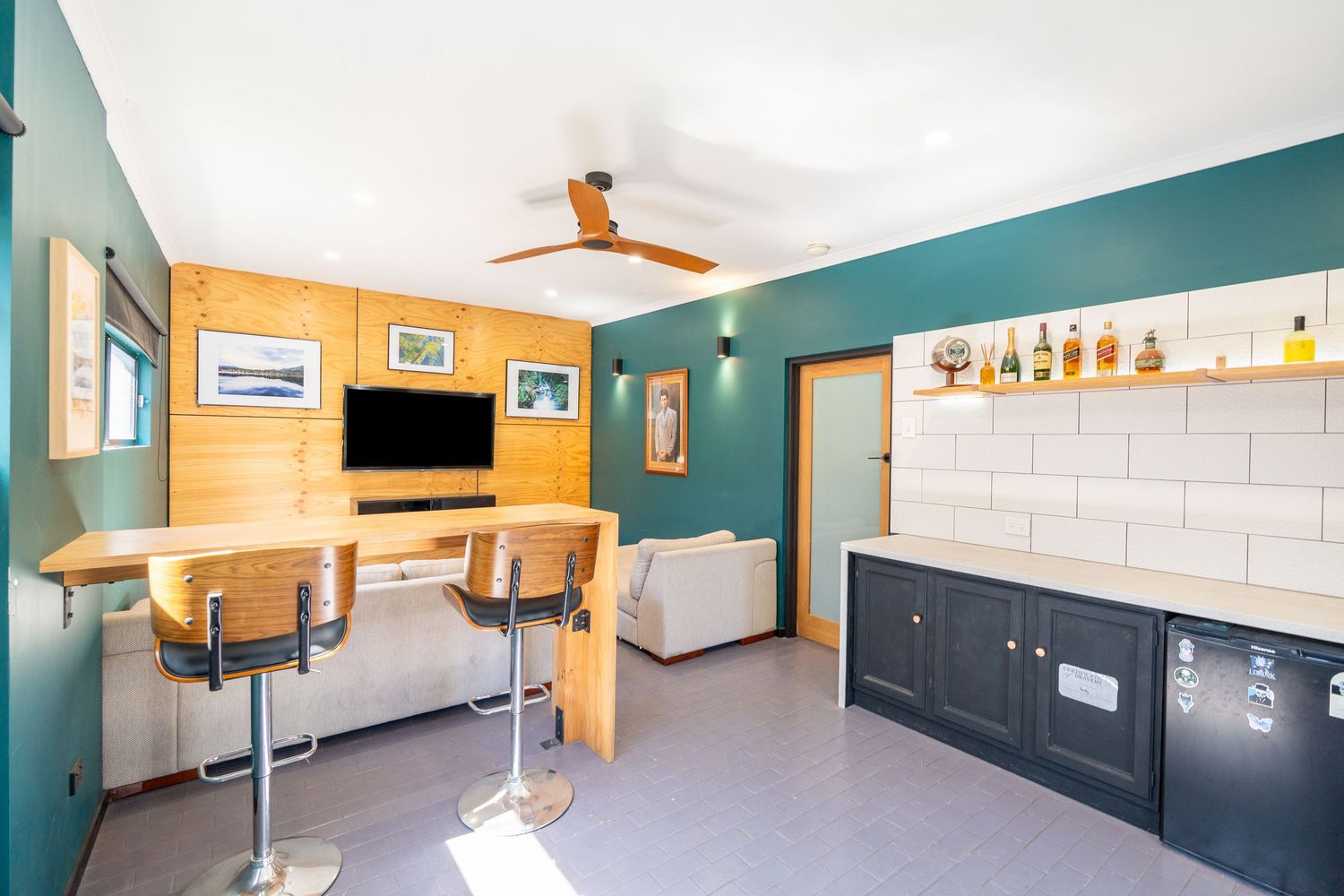 Rumpus room with bar area and relaxed entertainment layout.