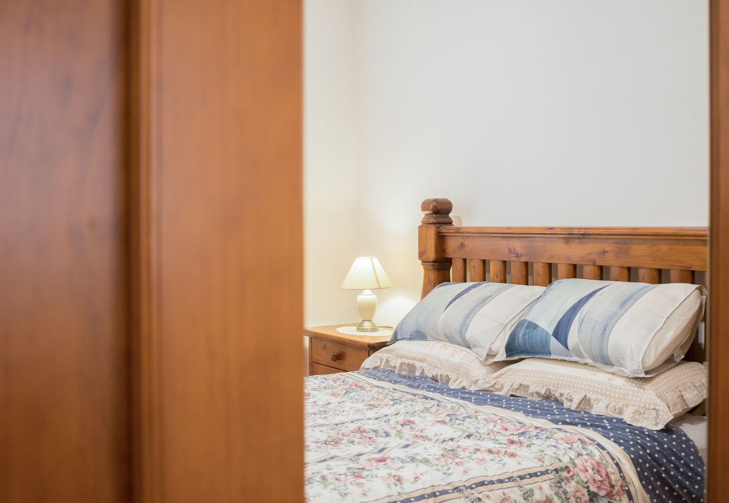 Styled main bedroom with soft lighting and modern décor.