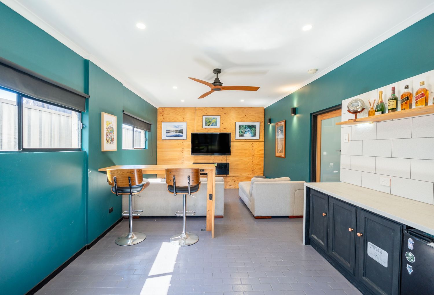 Rumpus room with bar area and relaxed entertainment layout.