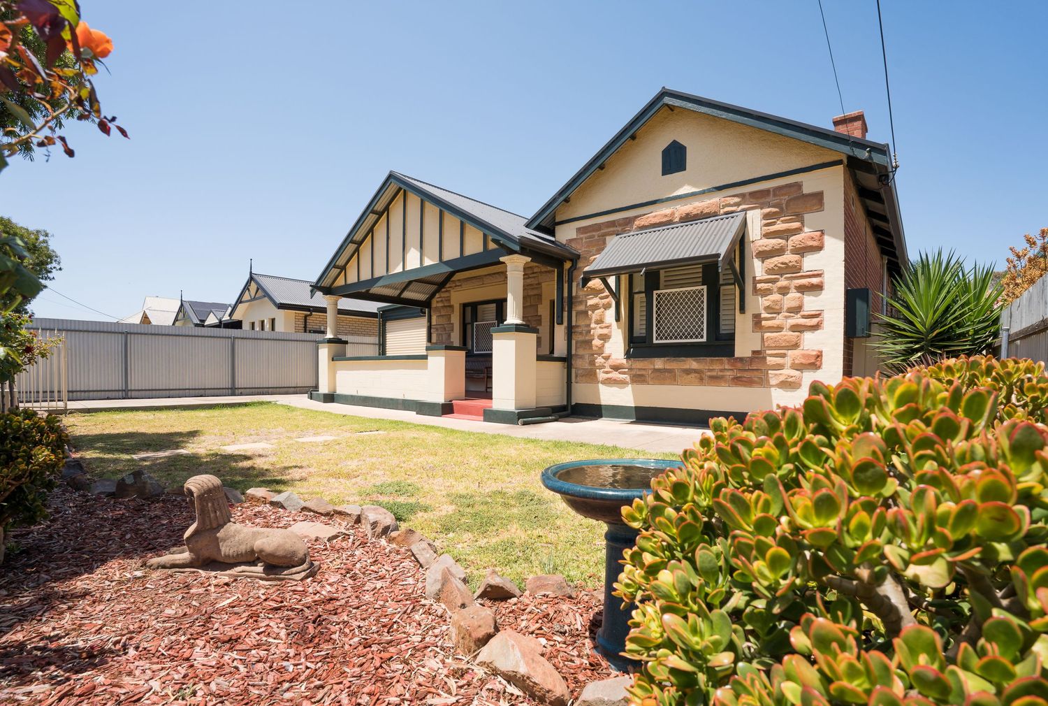 Front exterior of a character home with clean architectural lines.