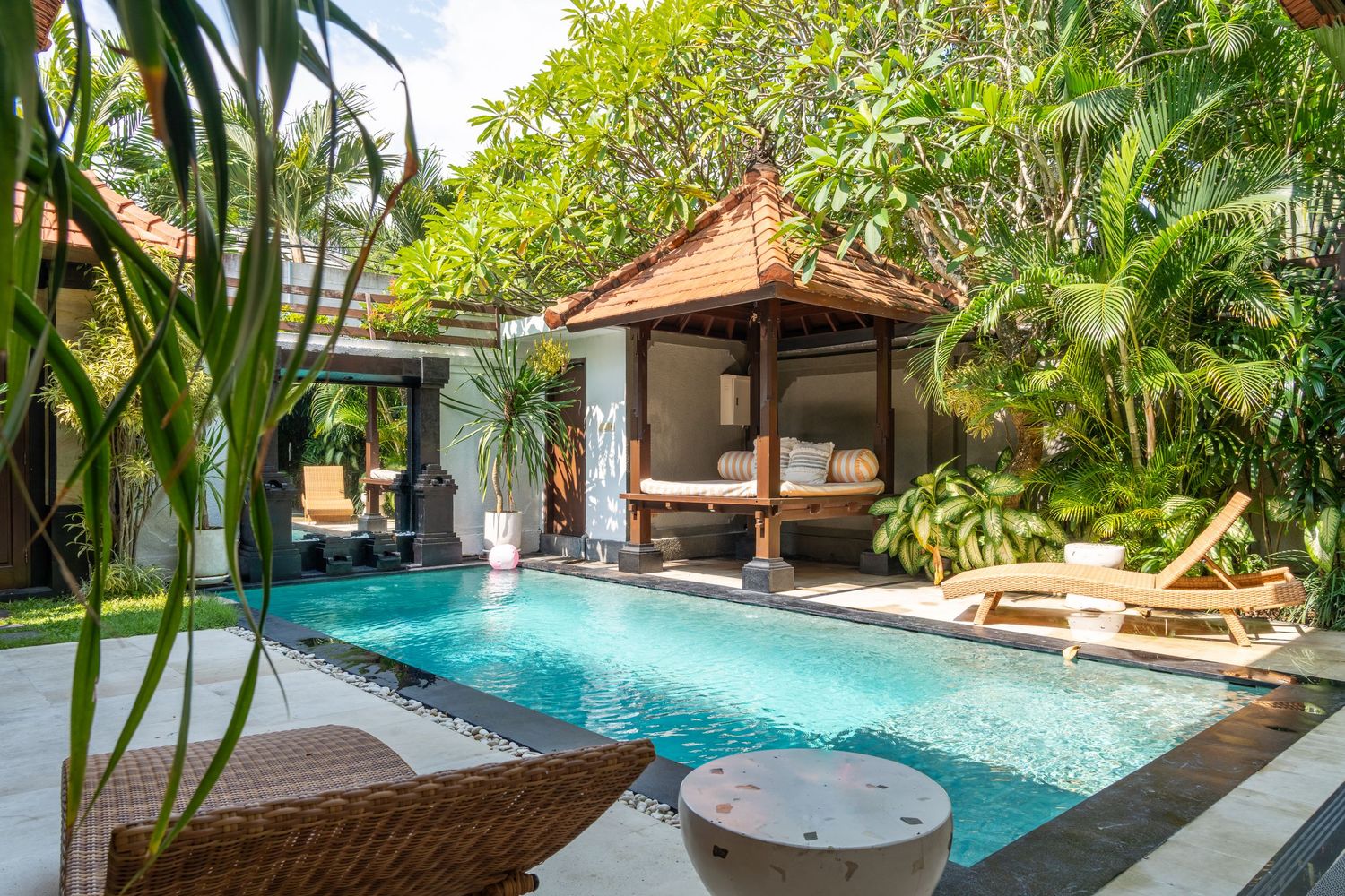Outdoor pool area with clear water and modern landscaping.