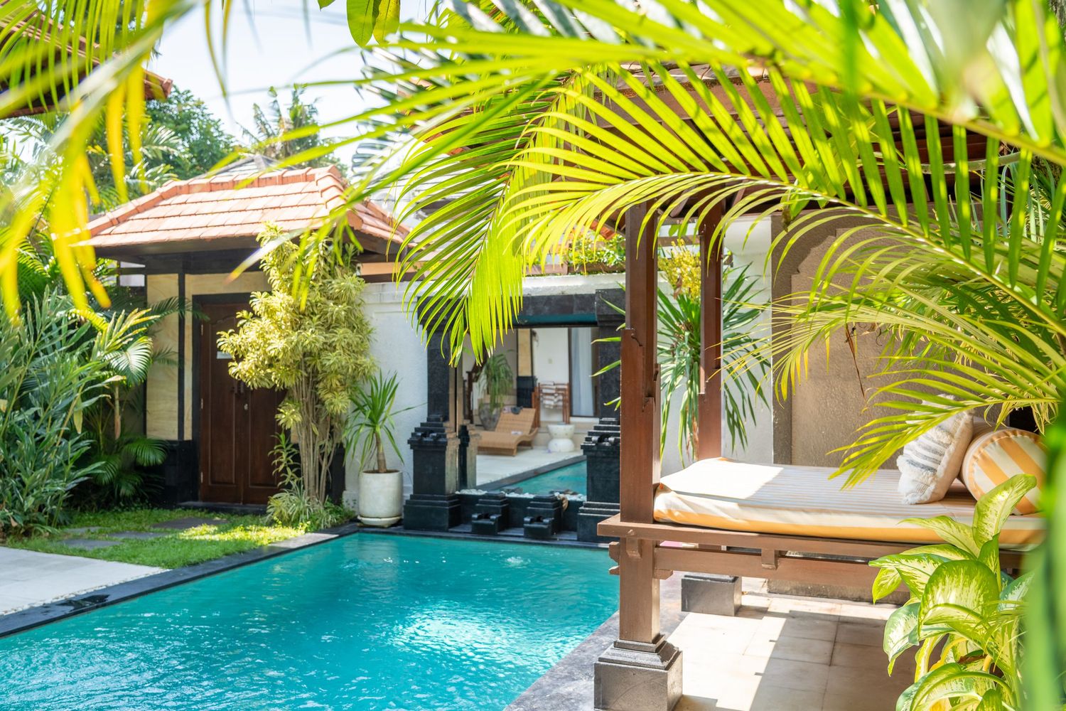 Outdoor pool area with clear water and modern landscaping.