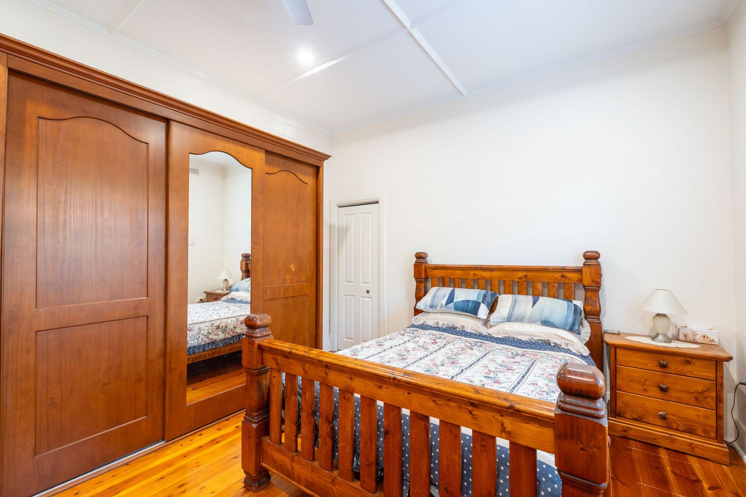 Styled main bedroom with soft lighting and modern décor.