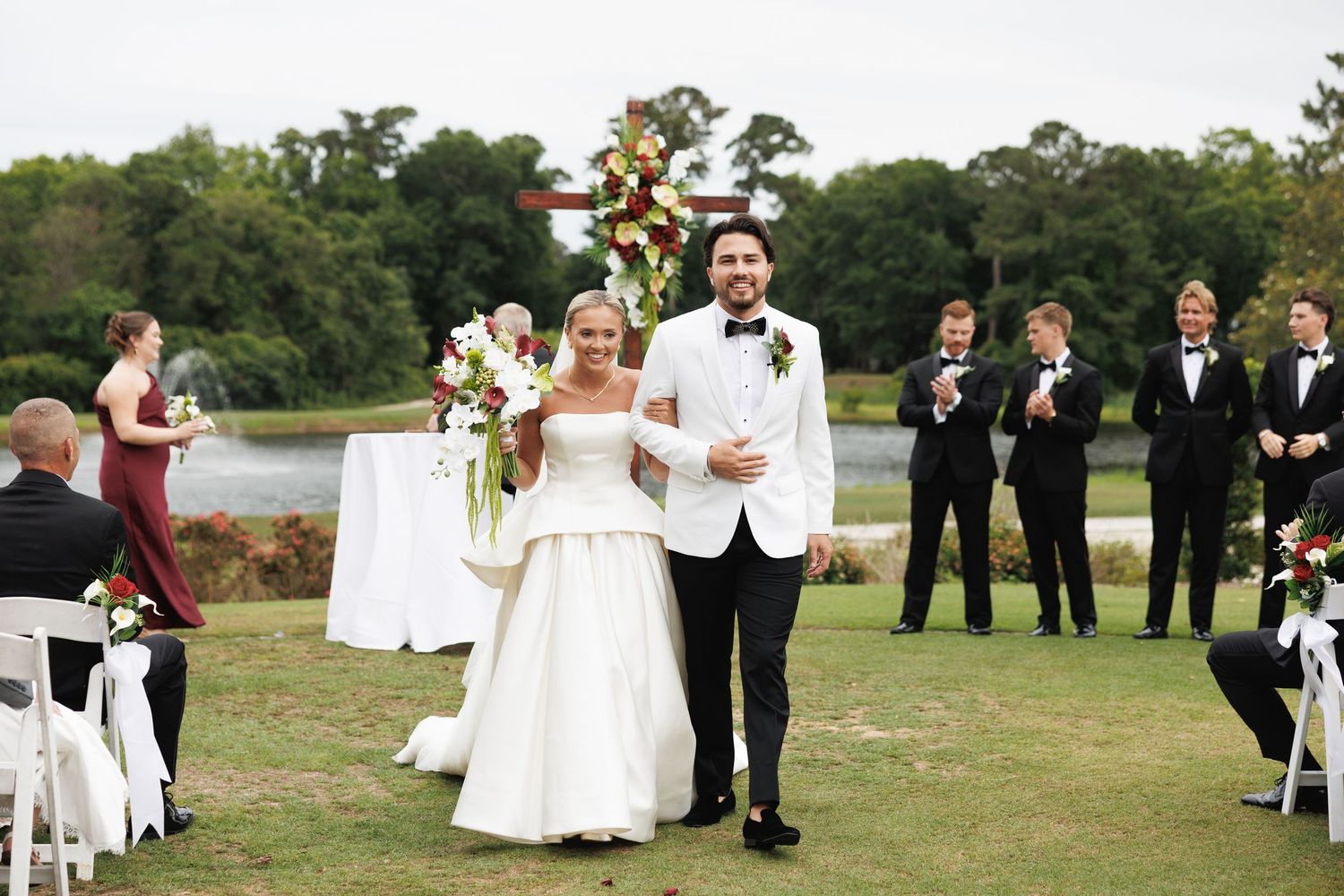 Bride and groom walking down the aisle during an outdoor Florida wedding ceremony