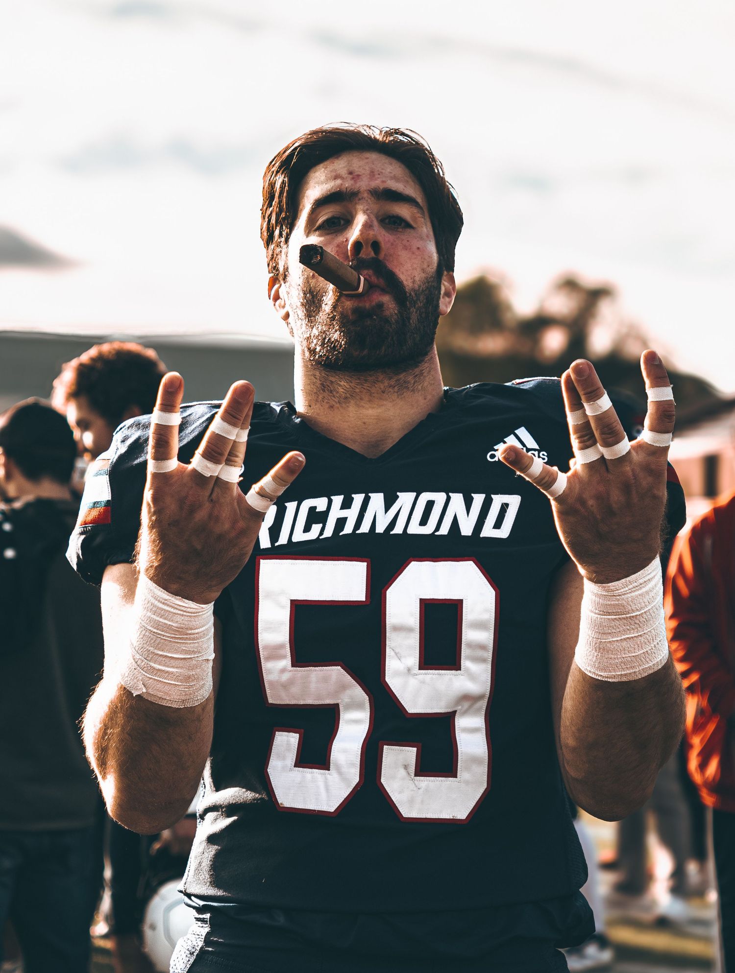 Football players in Richmond jerseys celebrating on the field.