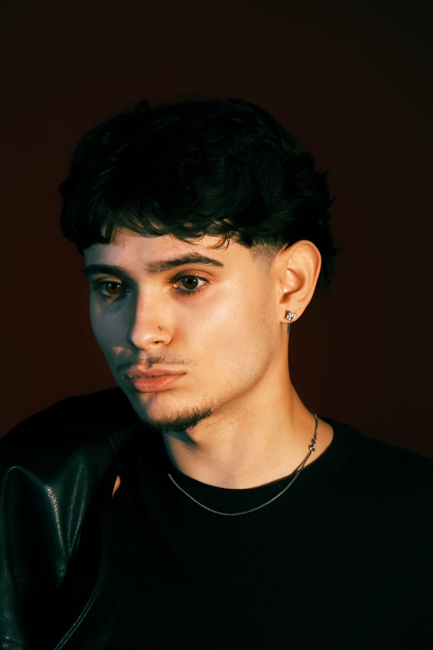 Artistic dark portrait series showing side profile views against black background.