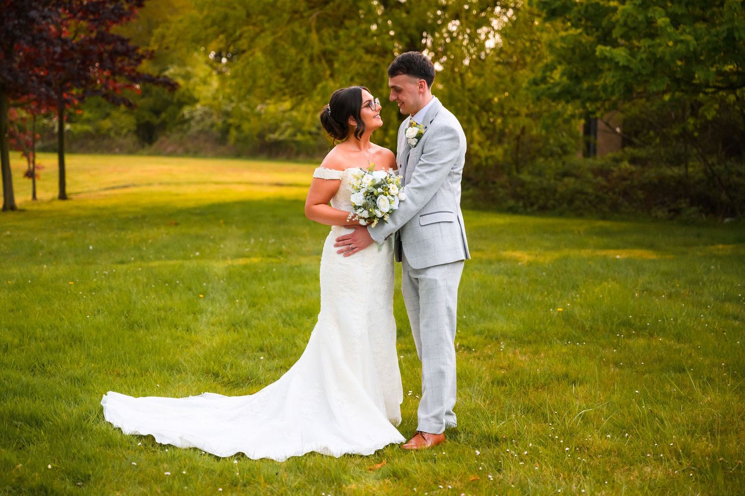 Couples wedding photo during golden hour at Holiday Inn Gosforth Park in Newcastle by professional wedding photographer with bride and groom