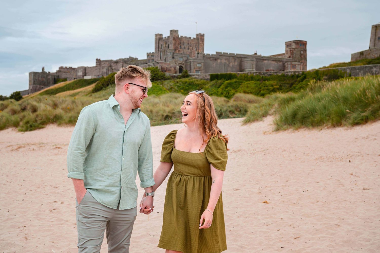 Natural outdoor couple portraits in Northumberland coast North East England pre-wedding session engagement shoot